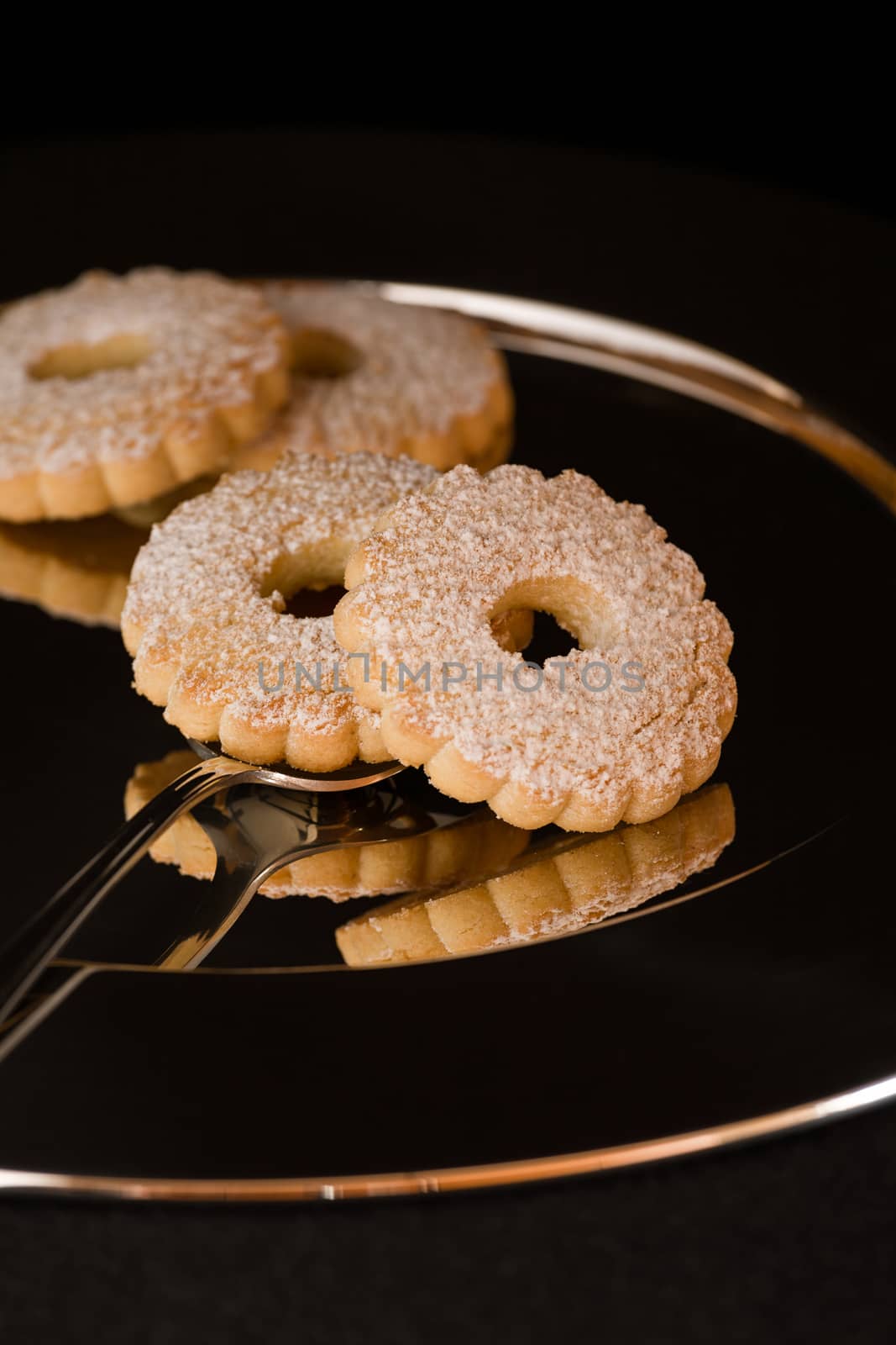 Biscuits reflected on a silver plate by LuigiMorbidelli