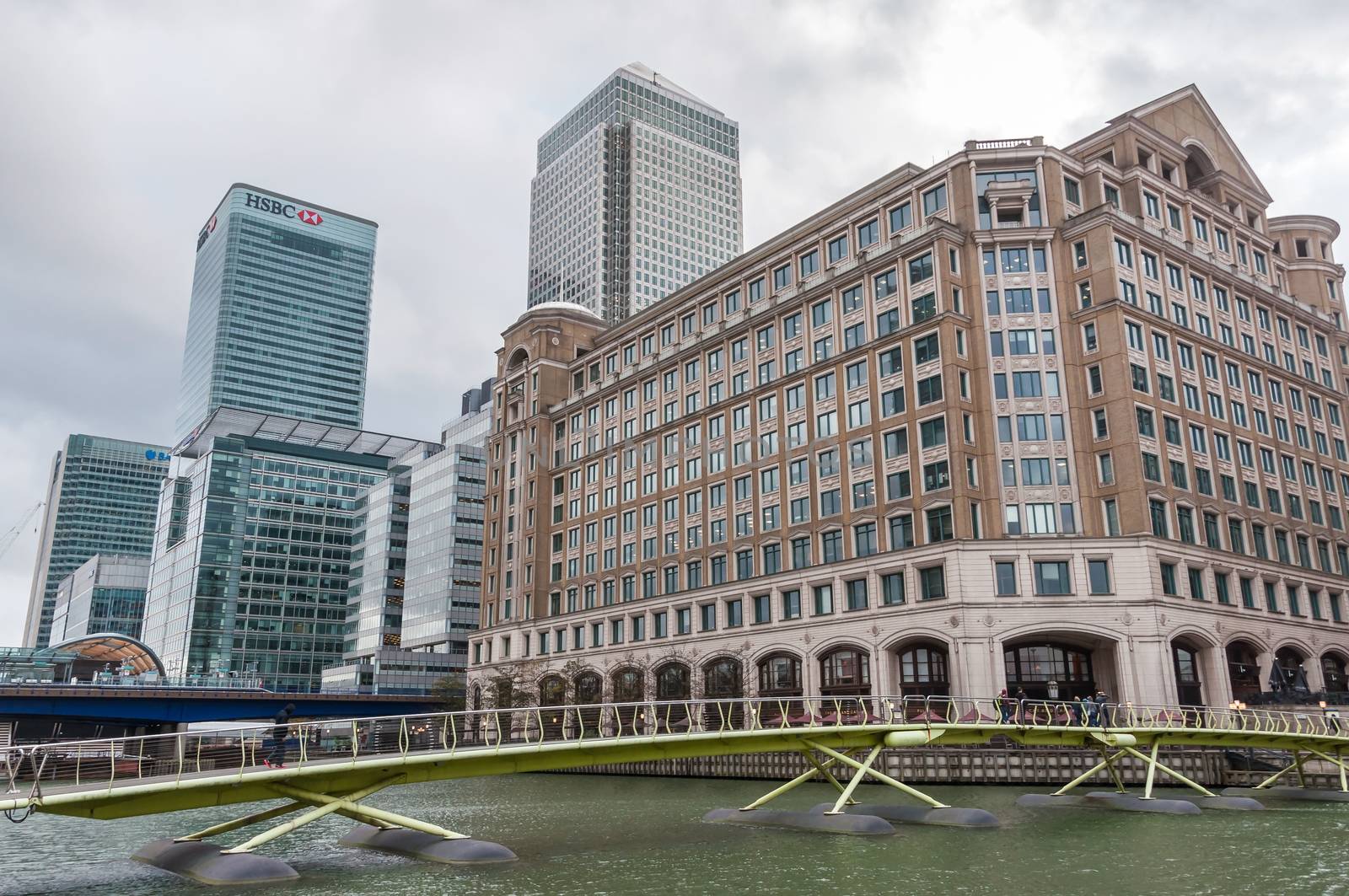 LONDON, UNITED KINGDOM - NOVEMBER 8, 2014: Modern buildings in North Dock in London's docklands on a cloudy day. Canary Wharf is one of London's two main financial centres.