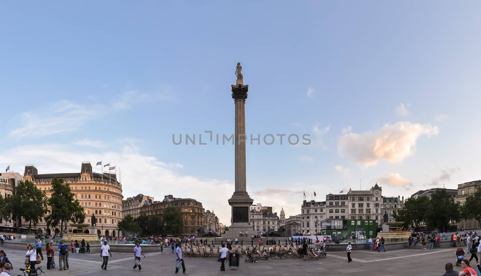 Tourists visit Trafalgar Square in London by mkos83