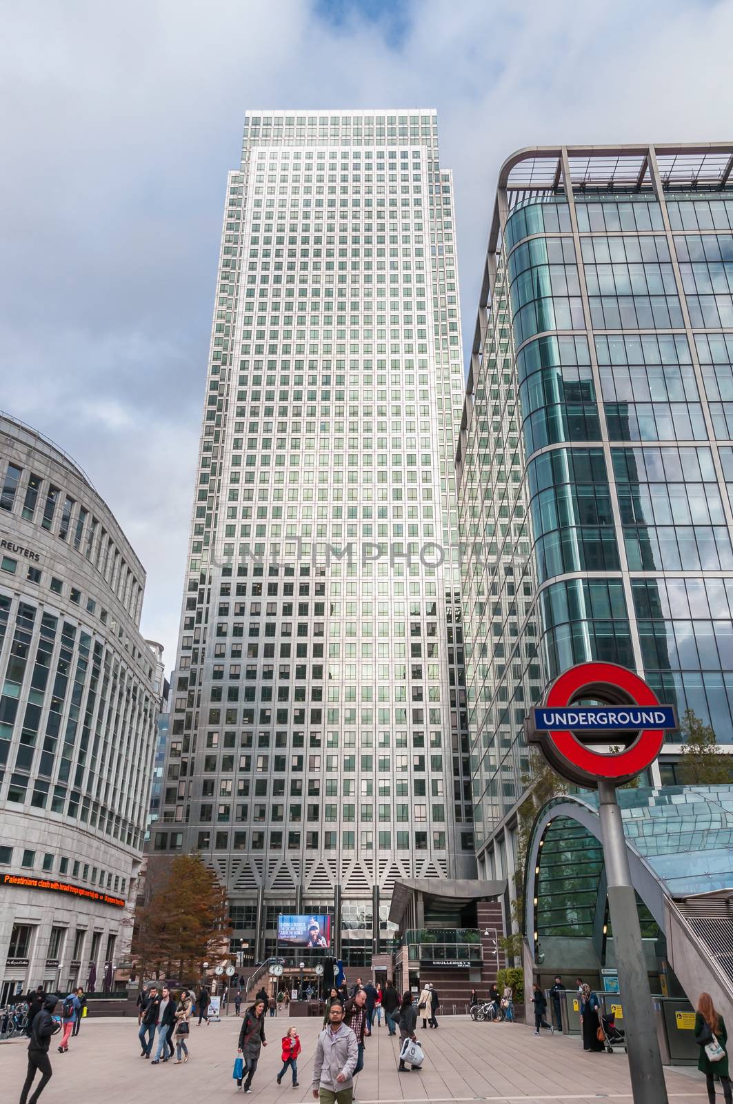 People enter Canary Wharf tube station in London's Docklands  by mkos83