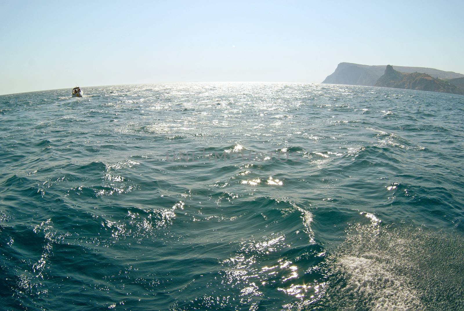 Waves on seascape in sun light at Black sea. Fish-eye lens.