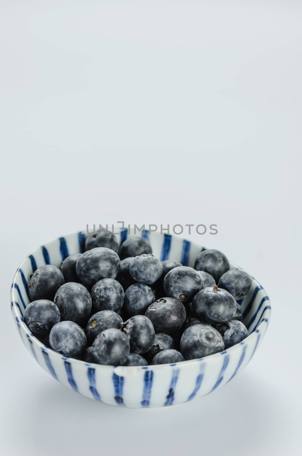 Blueberries in a bowl , organic fresh fruit