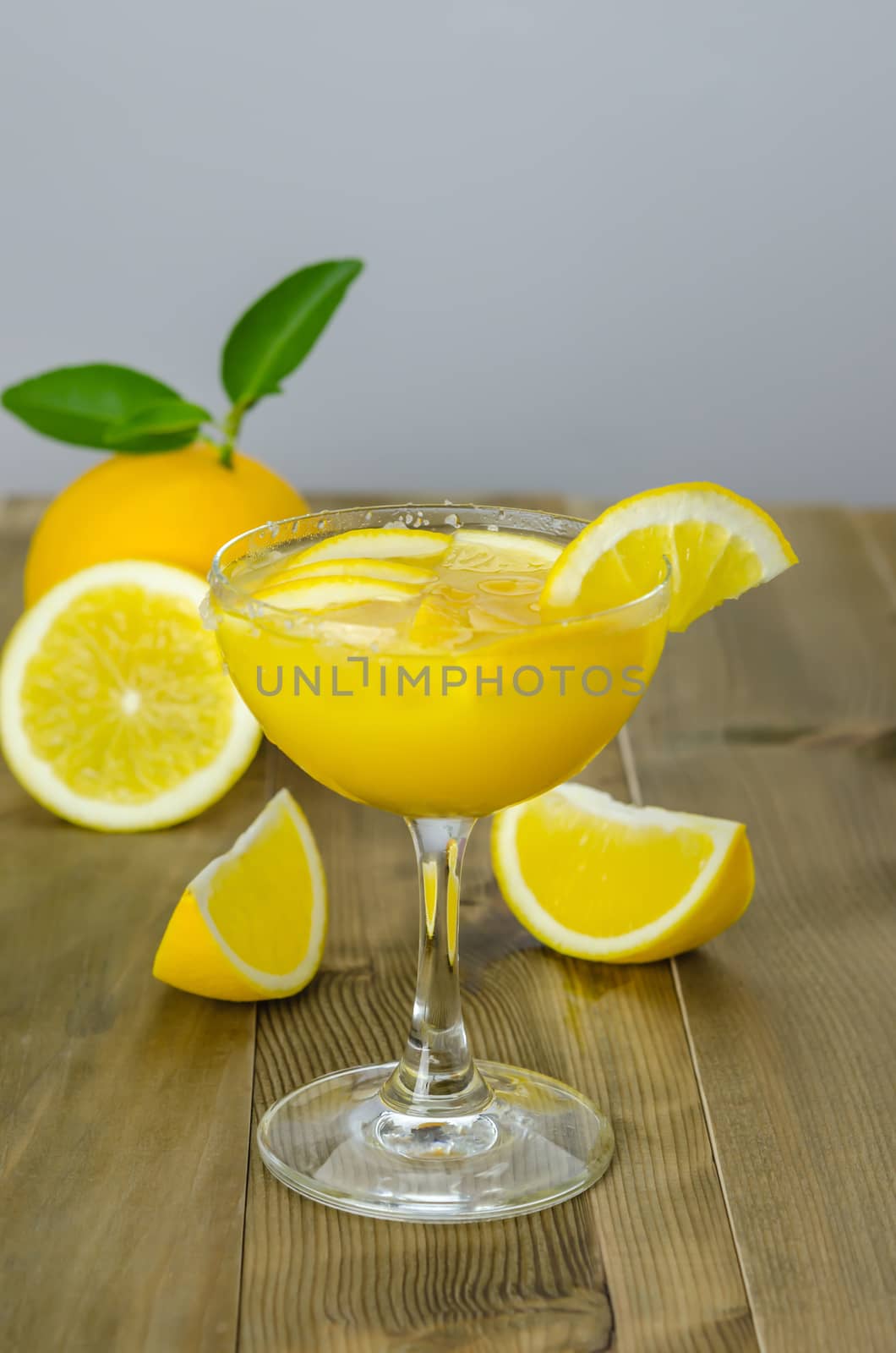 Orange juice and slices on wood