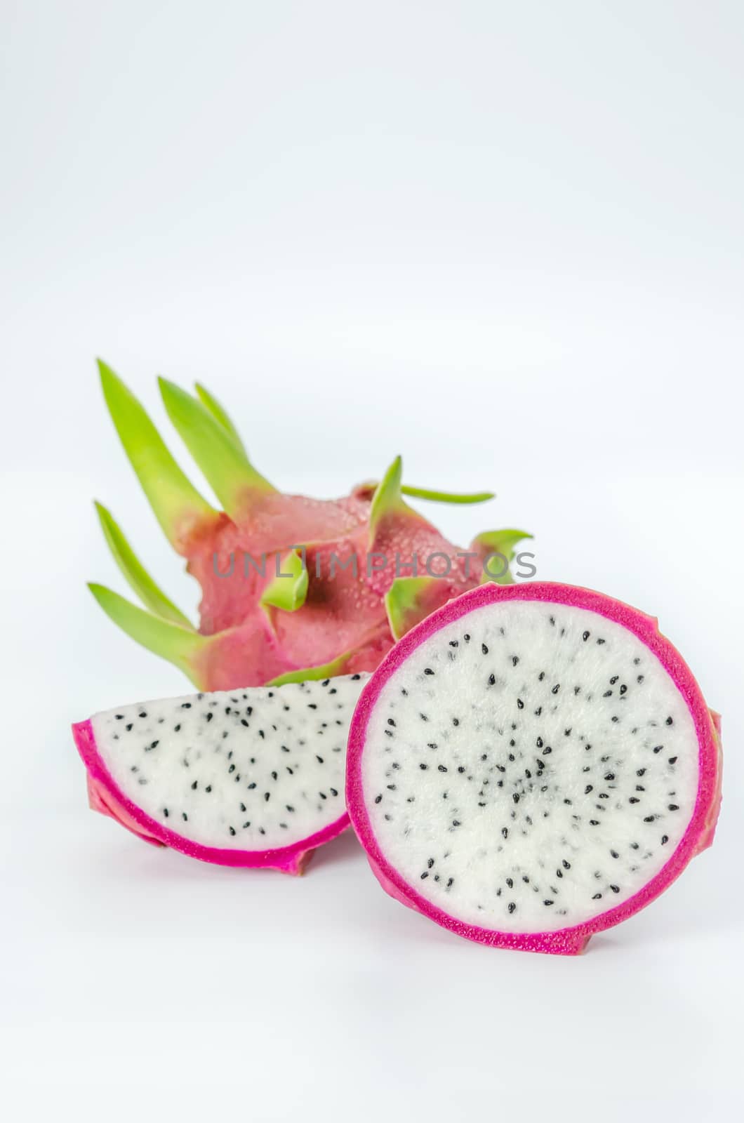 Ripe Dragon fruit or Pitaya with slice on white background