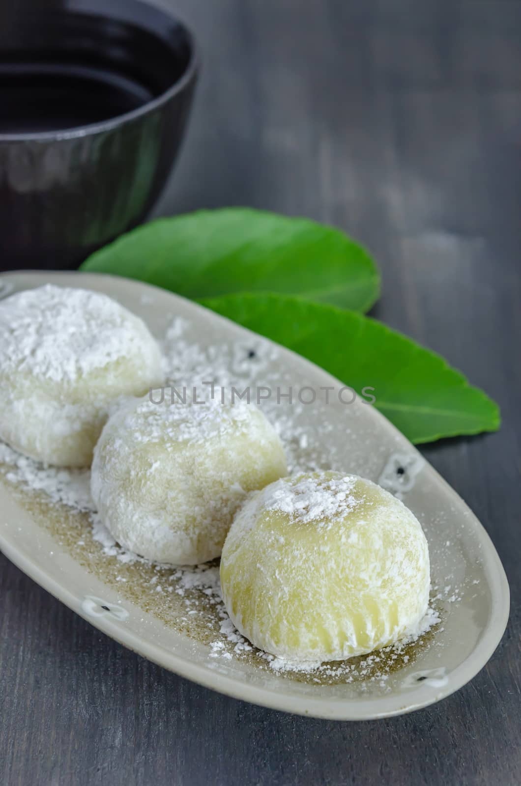 Daifuku Mochi Japanese dessert on dish with  hot tea , still life