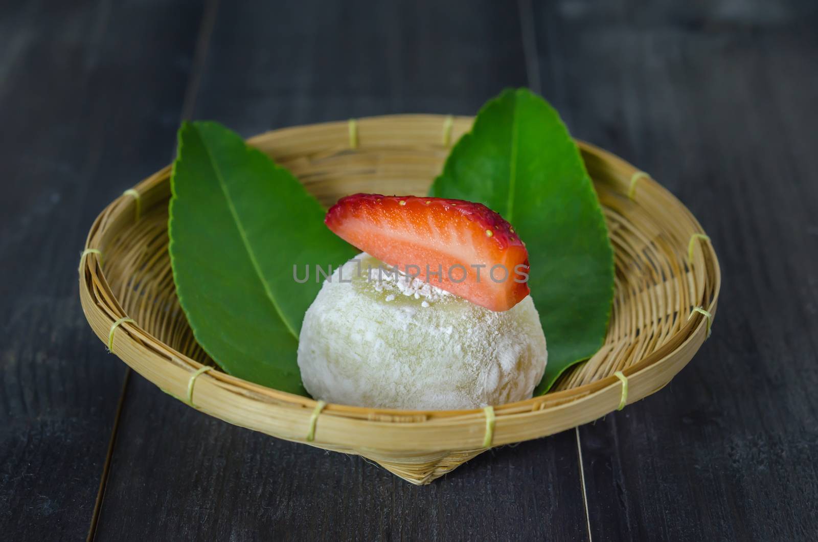 Strawberry Daifuku Mochi Japanese dessert on bamboo basket , still life