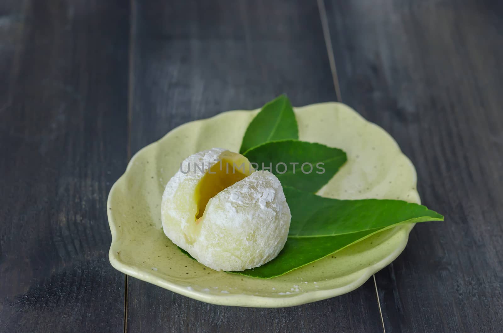 Daifuku Mochi Japanese dessert on dish over wooden background