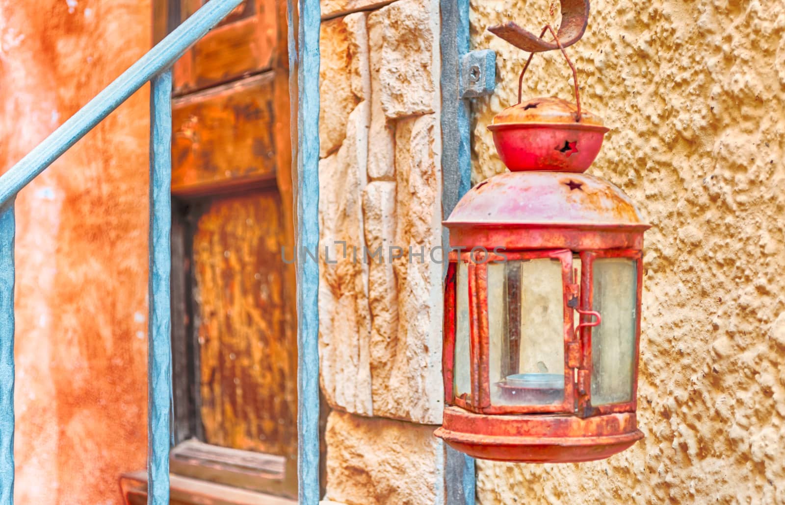 old lantern in alley of castelsardo old city by replica