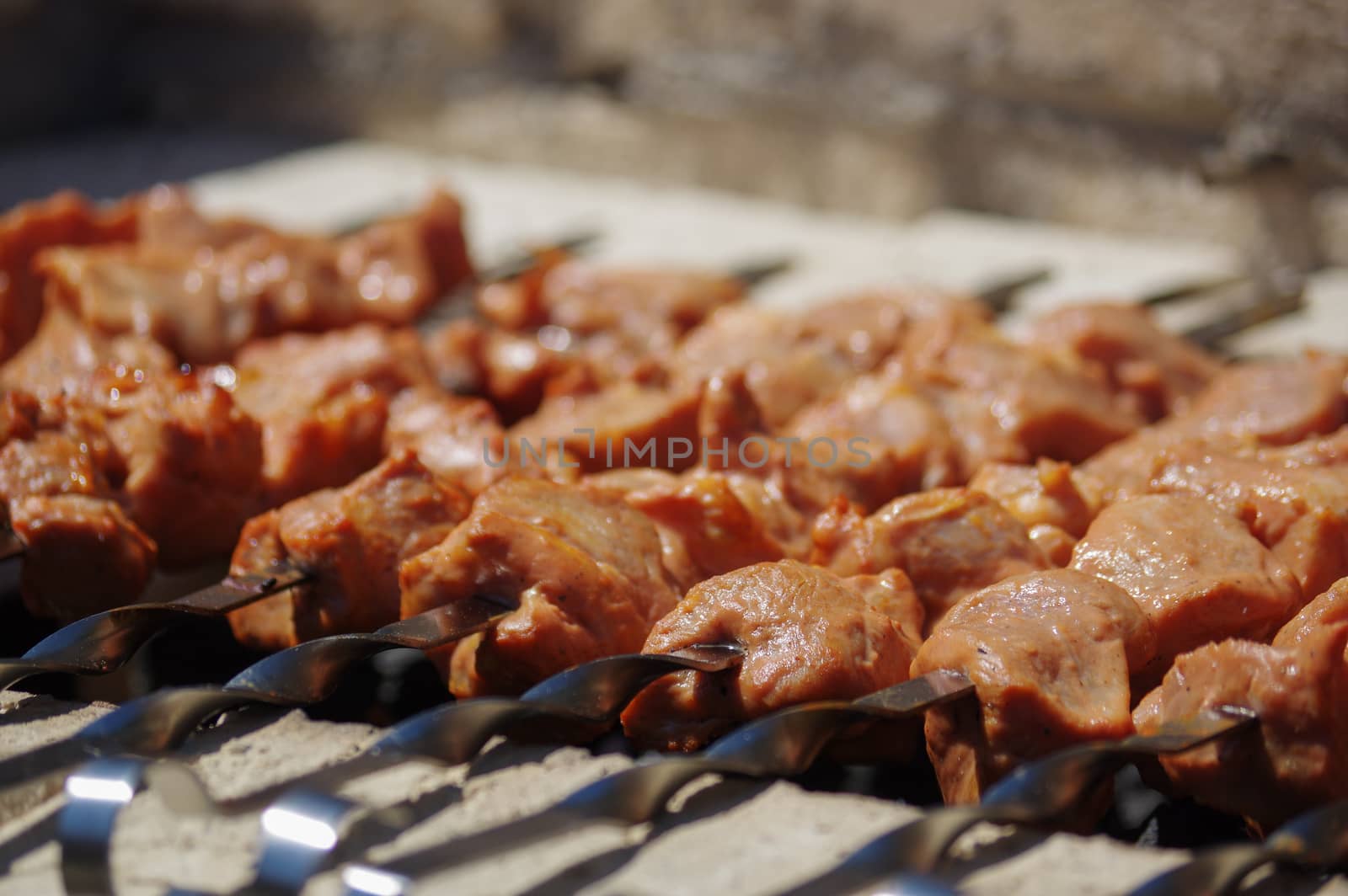 Shashlik on skewers closeup, raw and cooked by evolutionnow