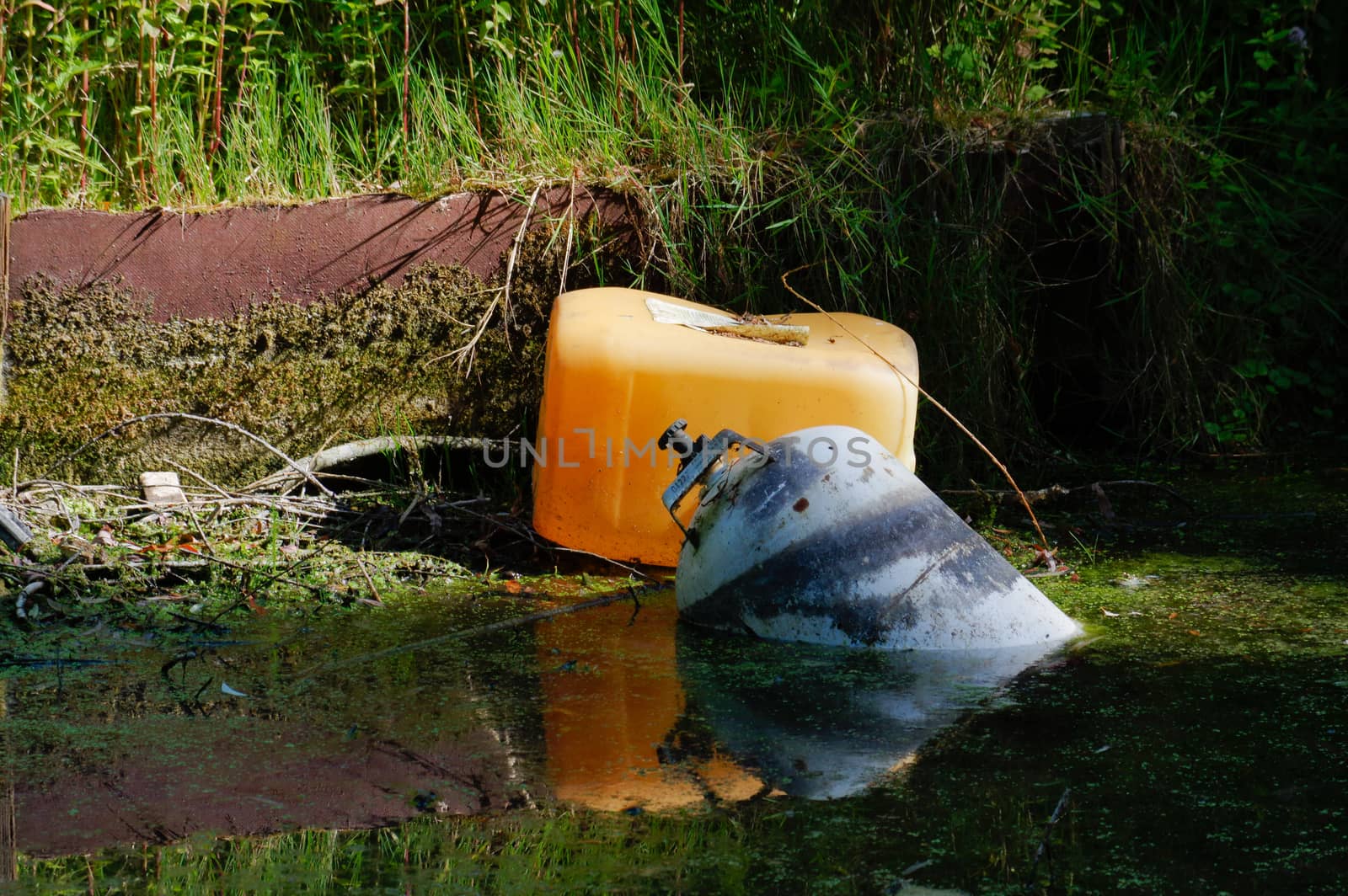 pollution trash in the bottom lake environmental problem by evolutionnow