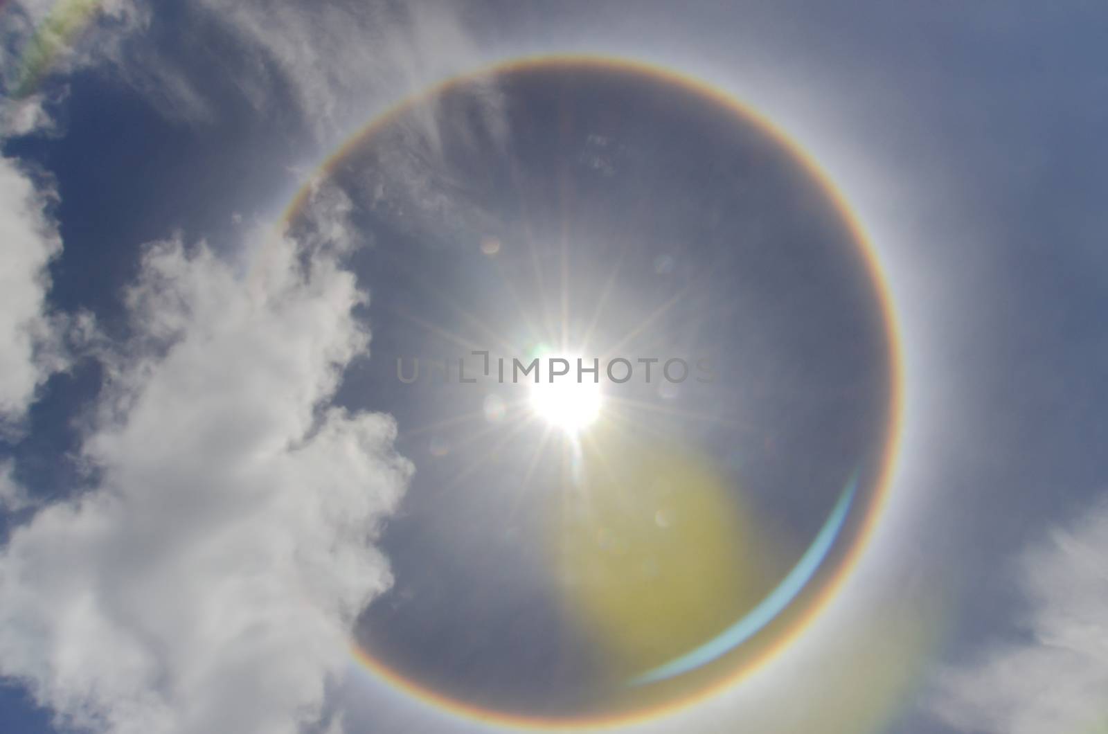 Sun with circular rainbow  sun halo occurring due to ice crystal by metal22