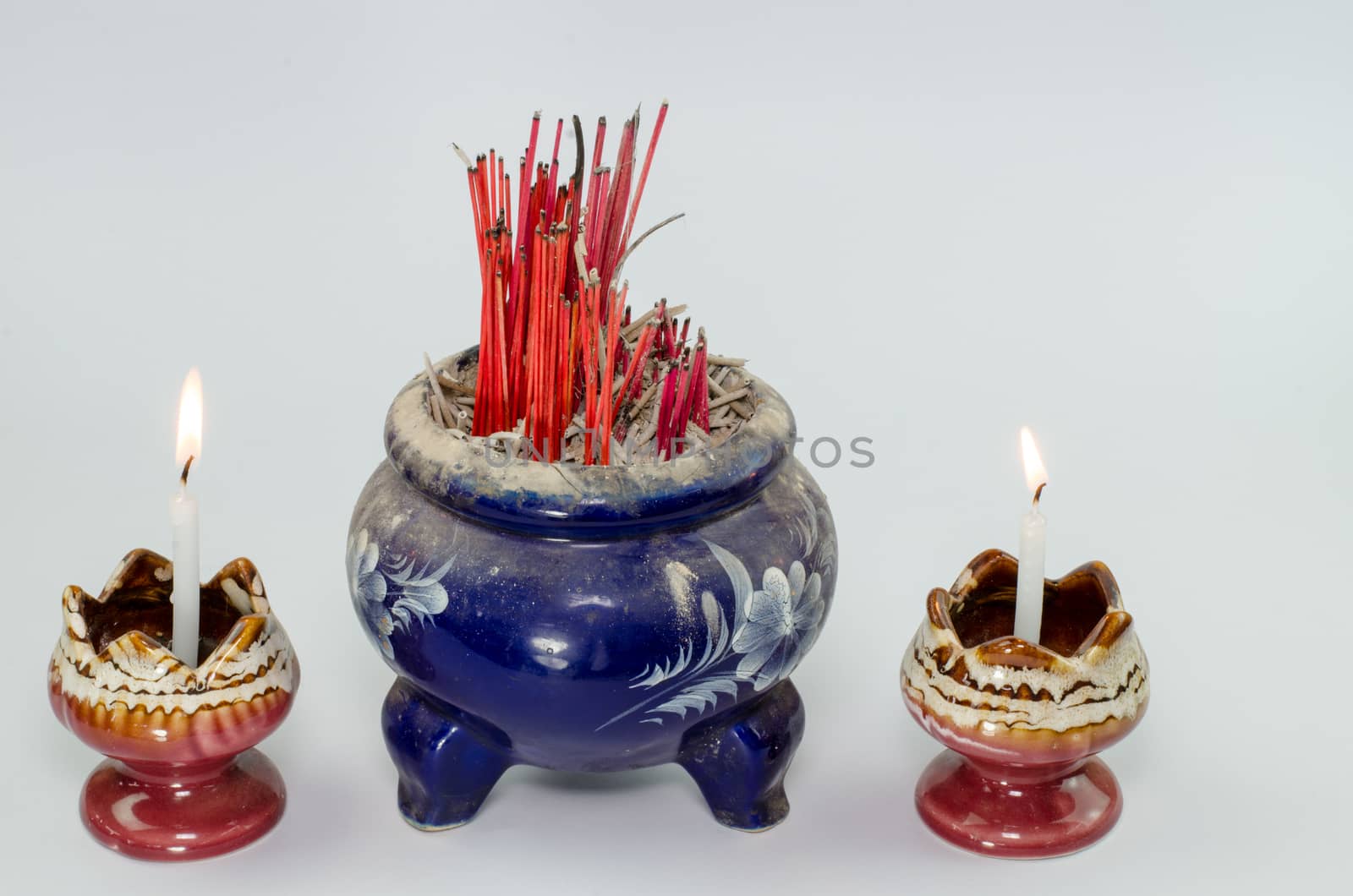 Incense burner and fire  on white background
