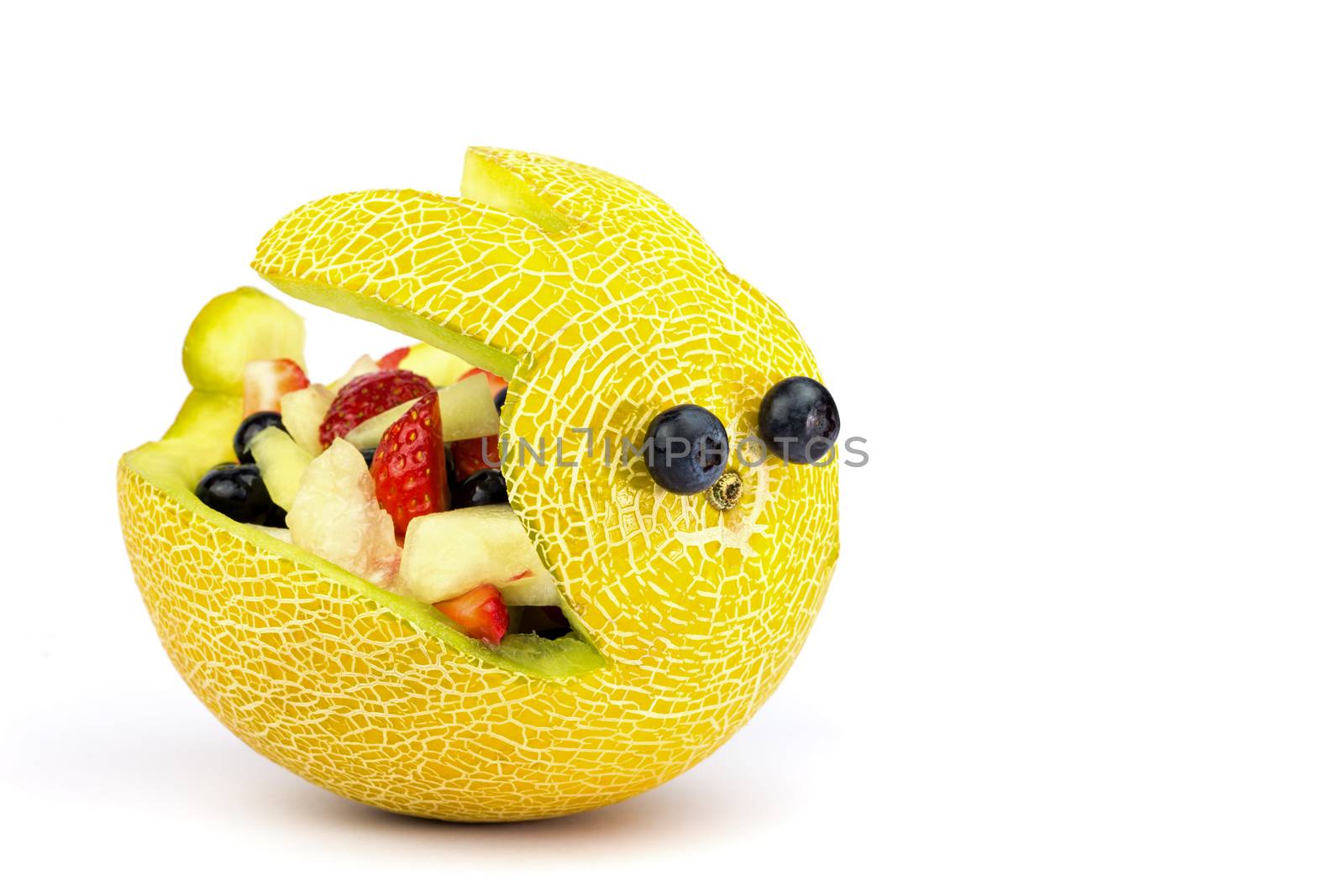 Melon Easter bunny filled with fresh summer fruit isolated on white background