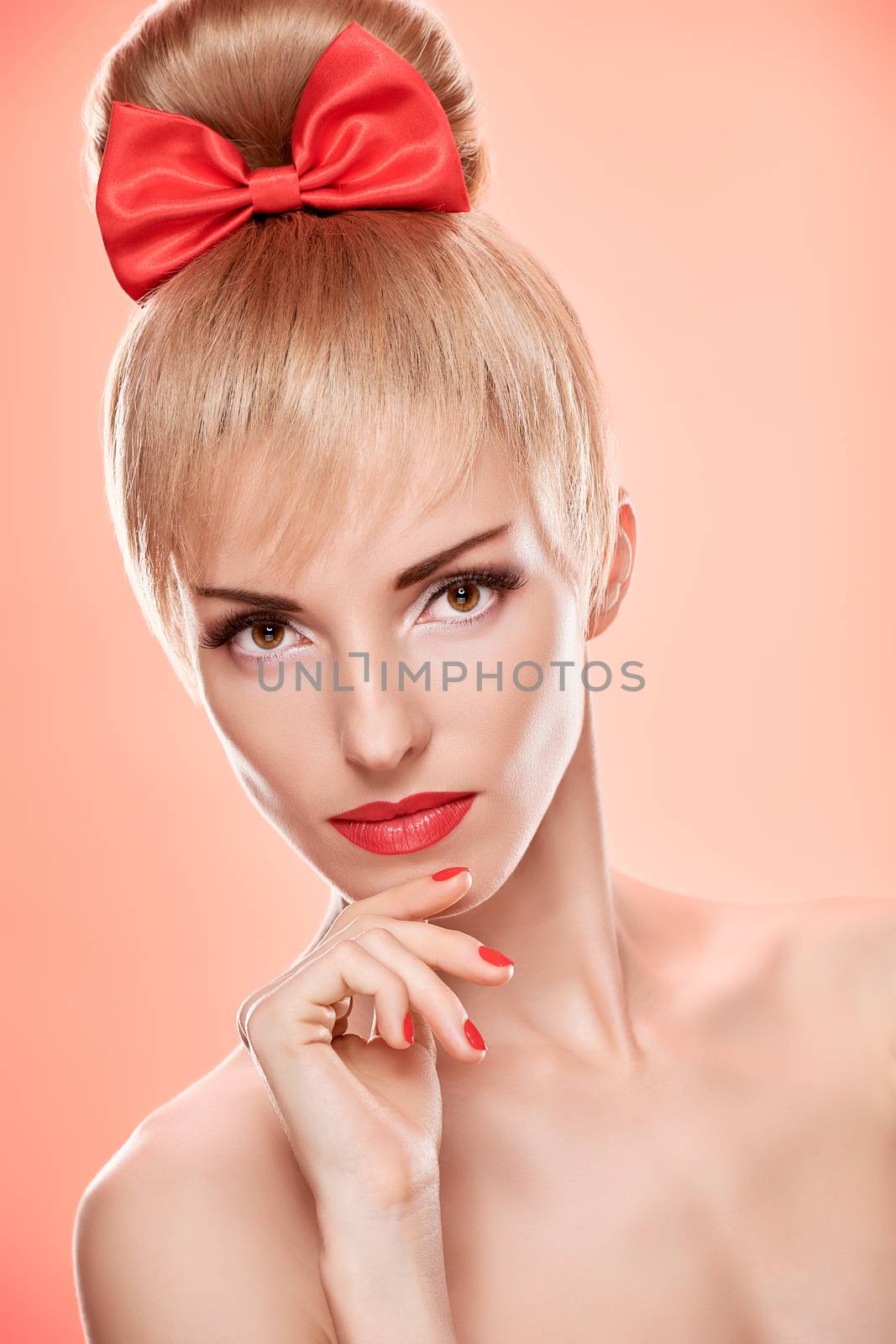 Beauty fashion portrait loving woman dreaming. Sensual attractive pretty nude blonde sexy girl, Pinup hairstyle, red bow. Confidence unusual emotional playful.Romantic, retro vintage, skincare on pink