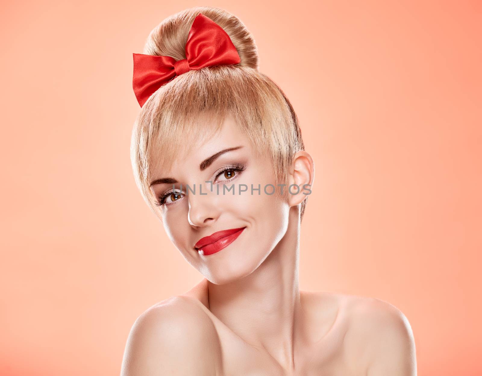 Beauty fashion portrait loving woman smiling. Sensual attractive pretty nude blonde sexy girl, Pinup hairstyle, red bow. Confidence unusual emotional playful. Romantic, retro vintage, skincare on pink