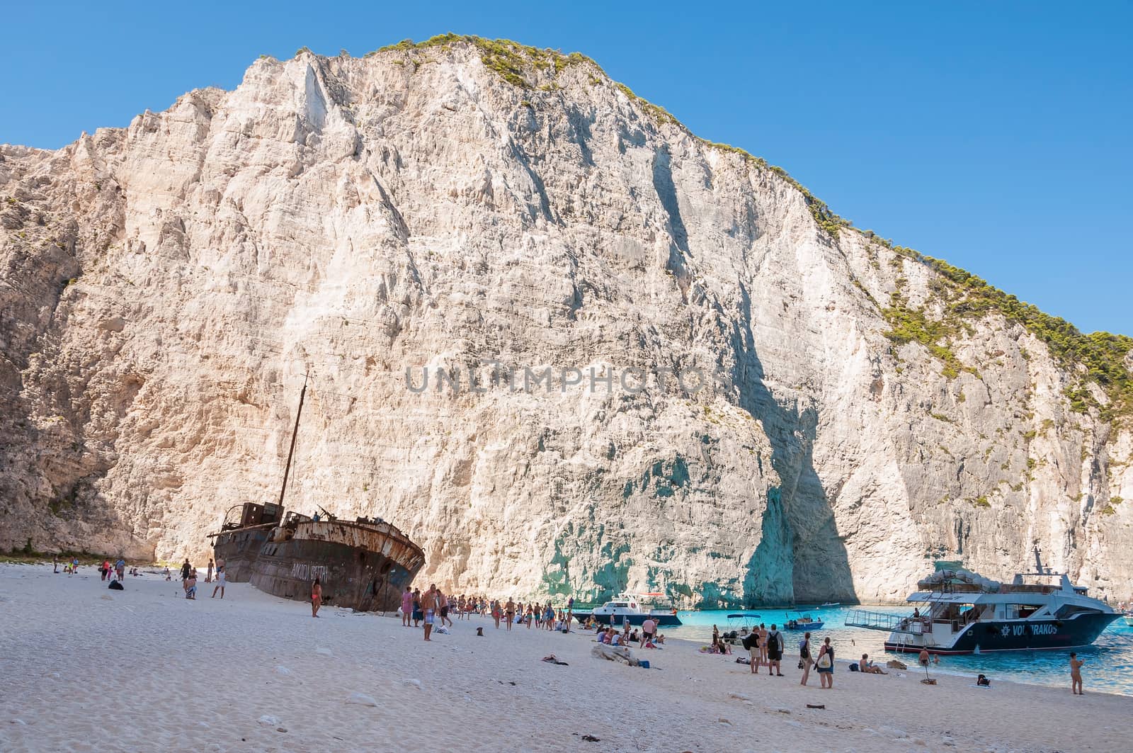 Tourists at the Navagio Beach on Zakynthos Island by mkos83