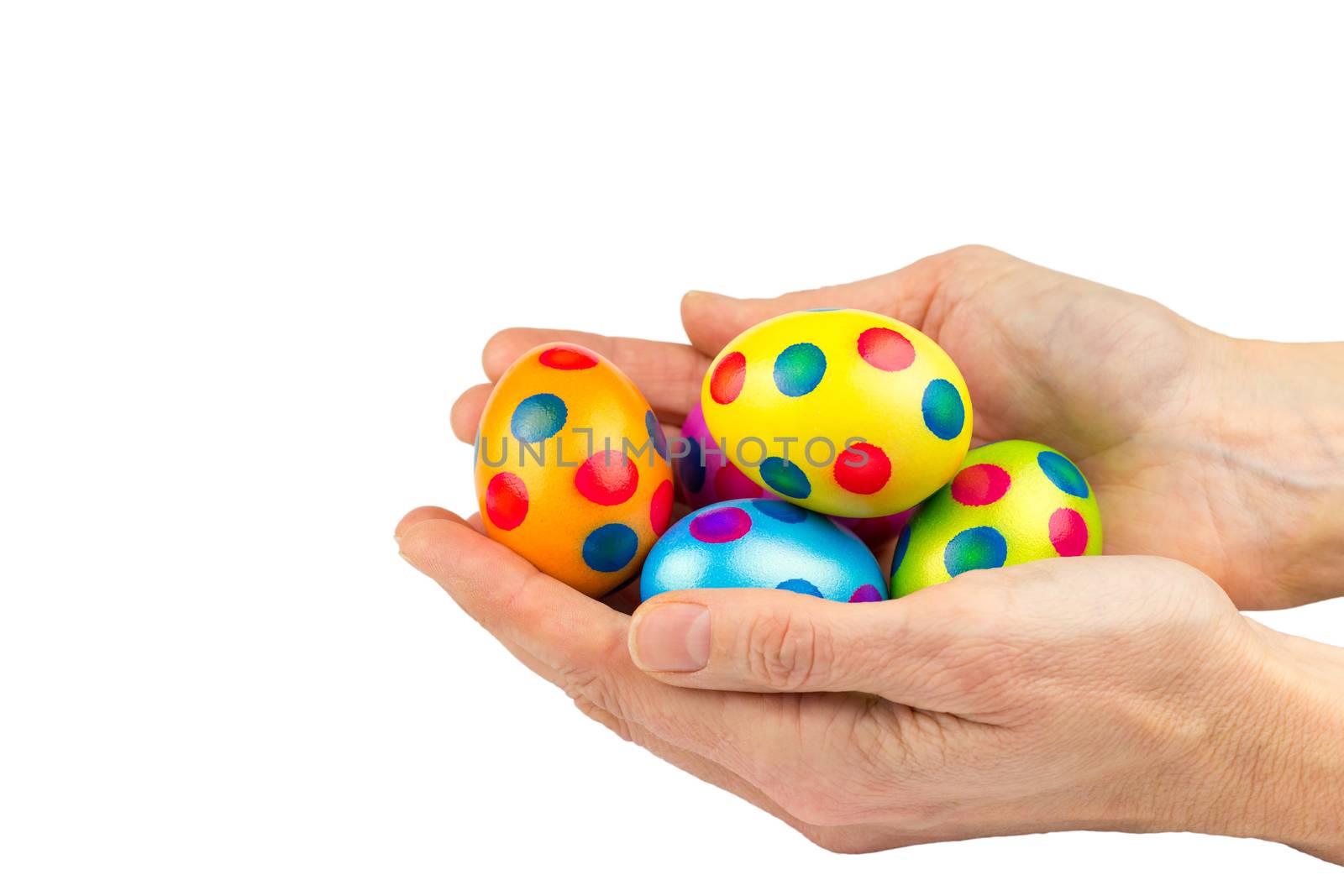 Two hands filled with painted chicken easter eggs isolated on white background