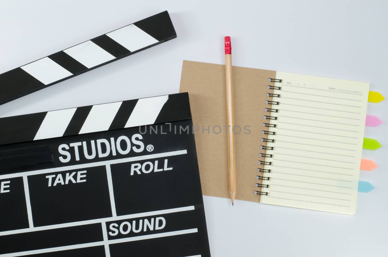 Slate film and notebook white background by metal22