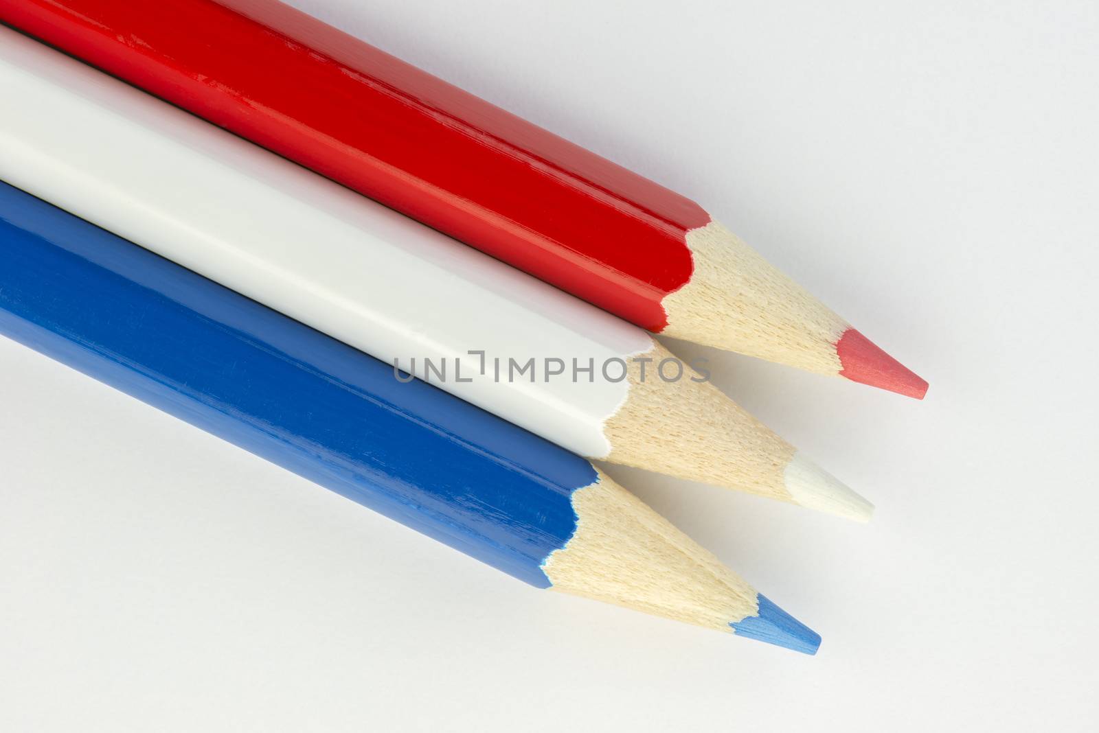 Collection of colorful pencils in Dutch flag colors red white and blue as a background picture

