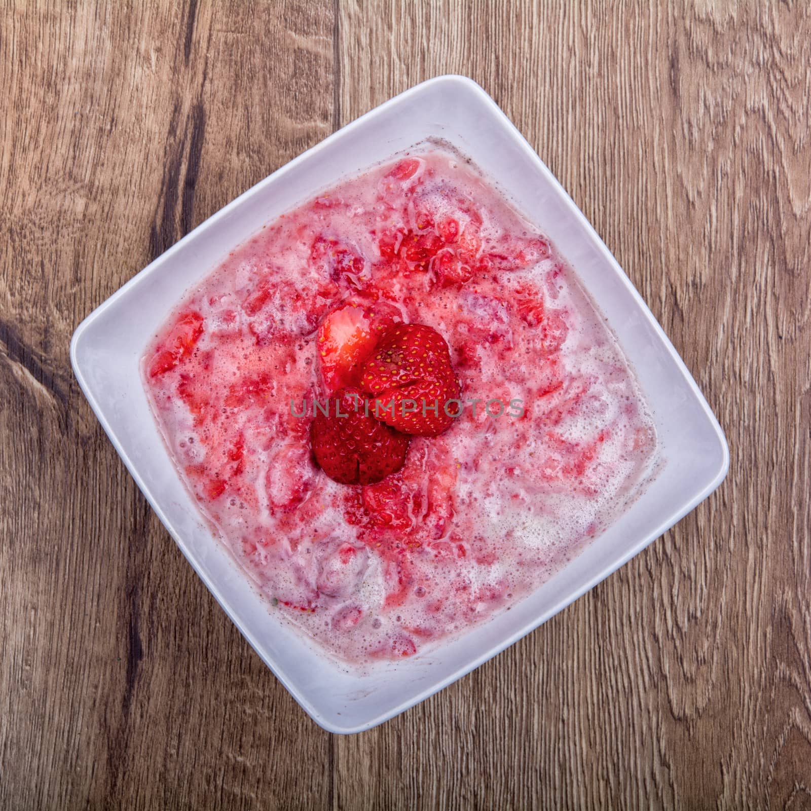 Strawberry puree, decorated with fresh strawberries