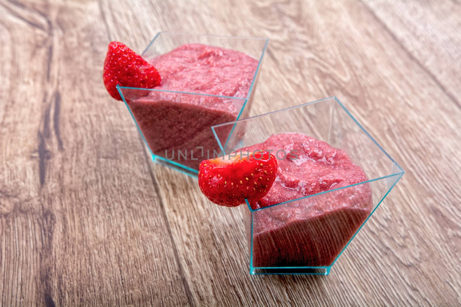 Strawberry puree, decorated with fresh strawberries