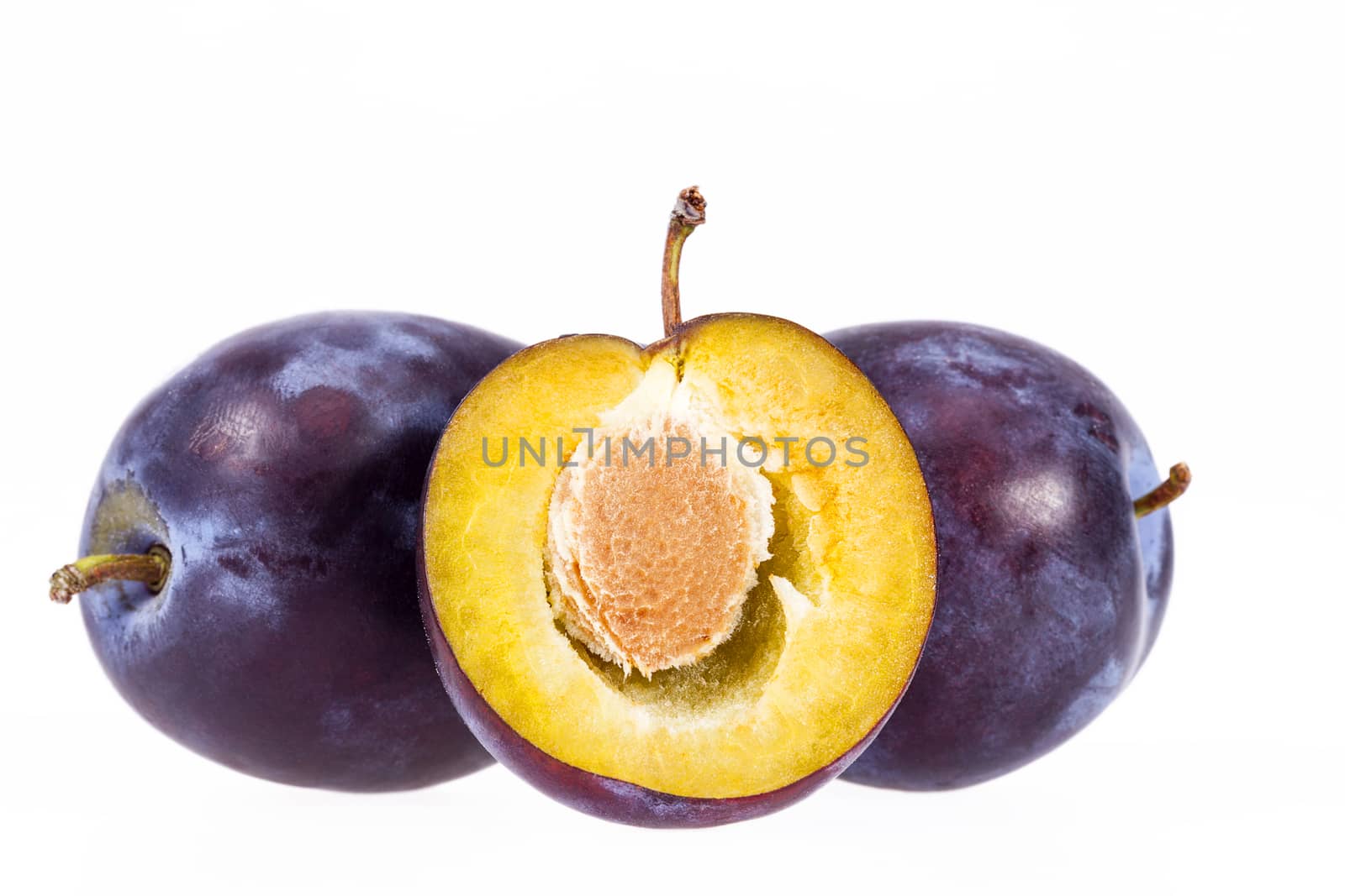Some fruits of plum isolated on white background, close up