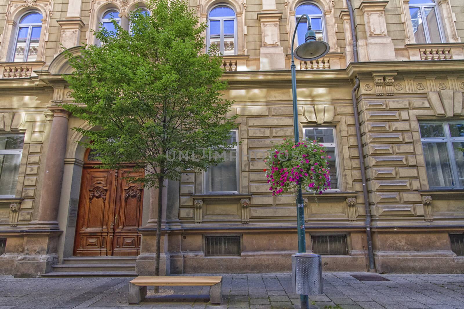 street scene with an old building and a bench