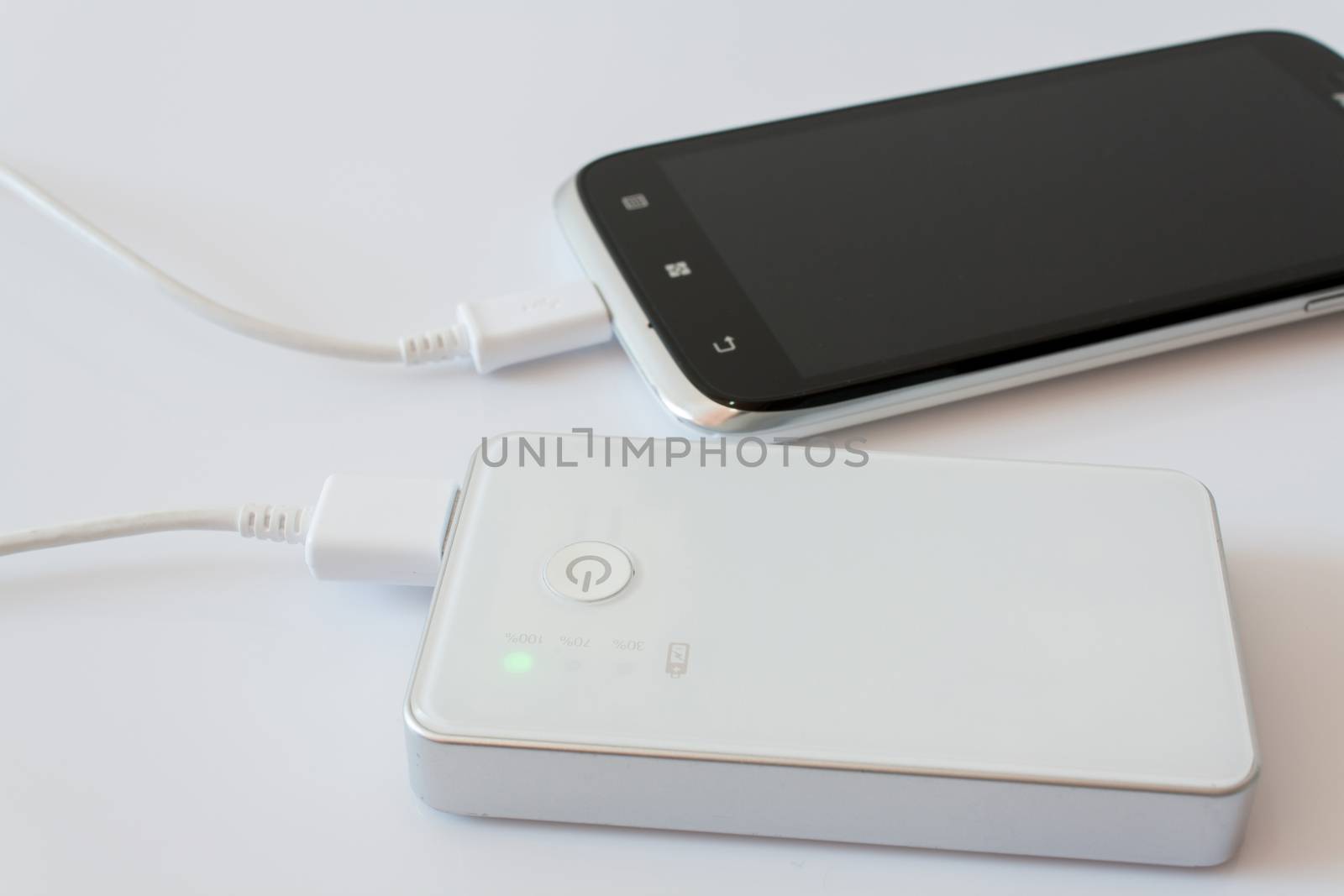 Smartphone is charging with power bank while it standby