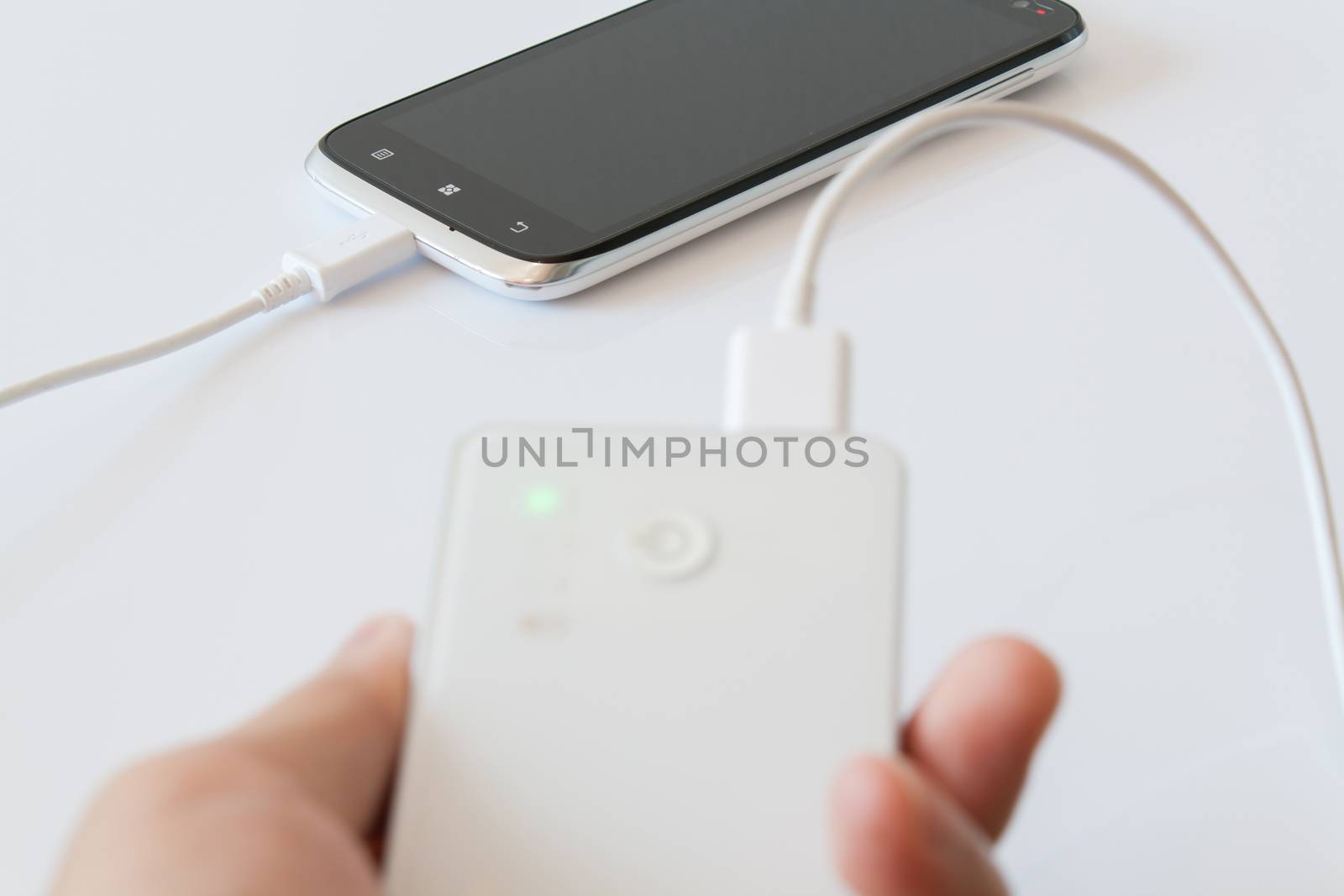 Smartphone is charging with power bank while it standby