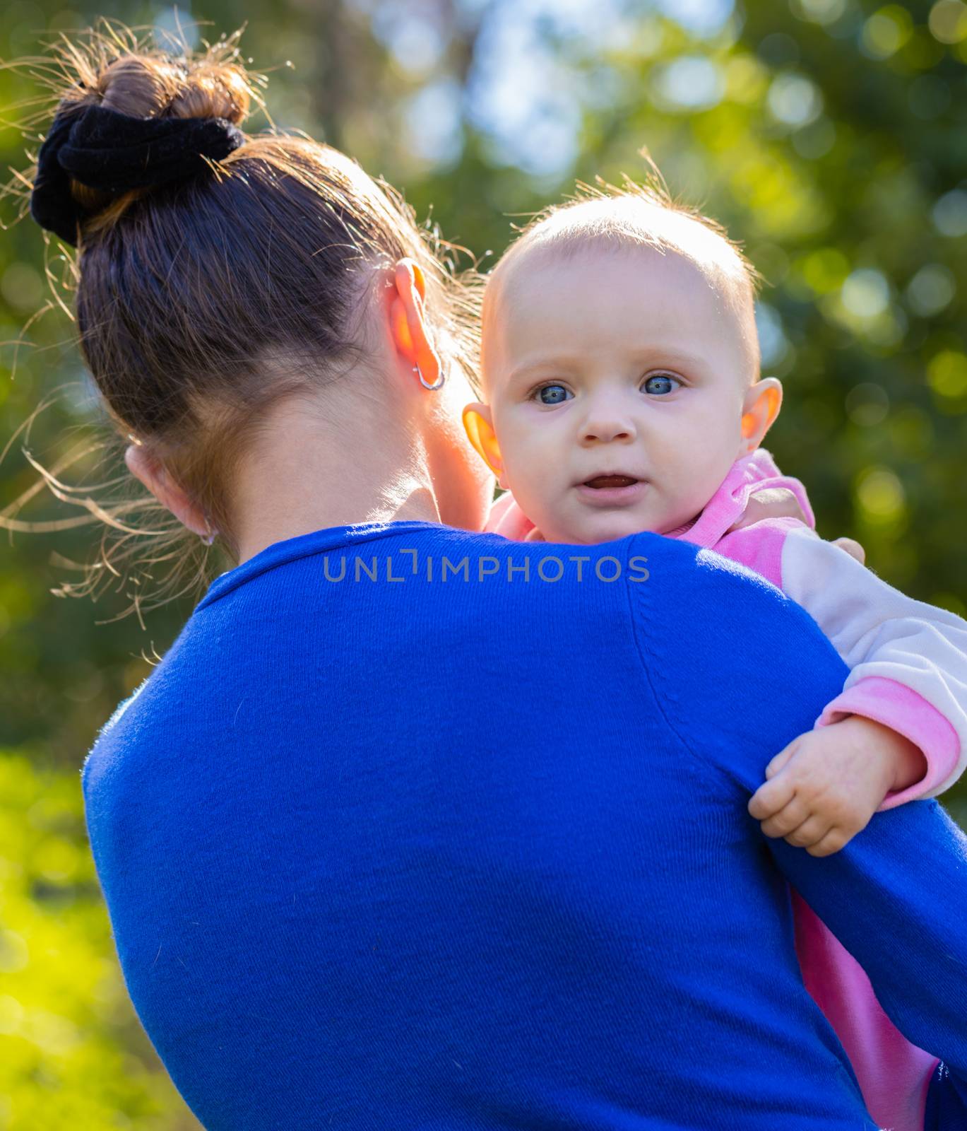 portrait of a smiling baby girl on hands