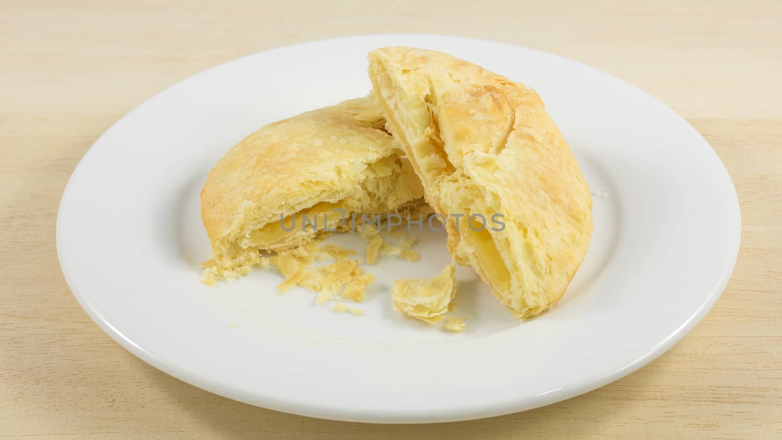 The Taiwanese sun cake (milk butter pastry) on the white plate.