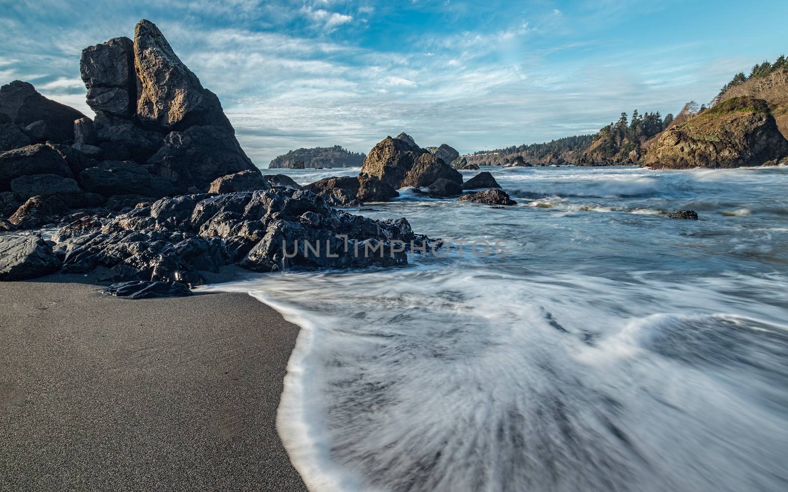 Long-exposure color image of the Pacific coastline at Sunset 