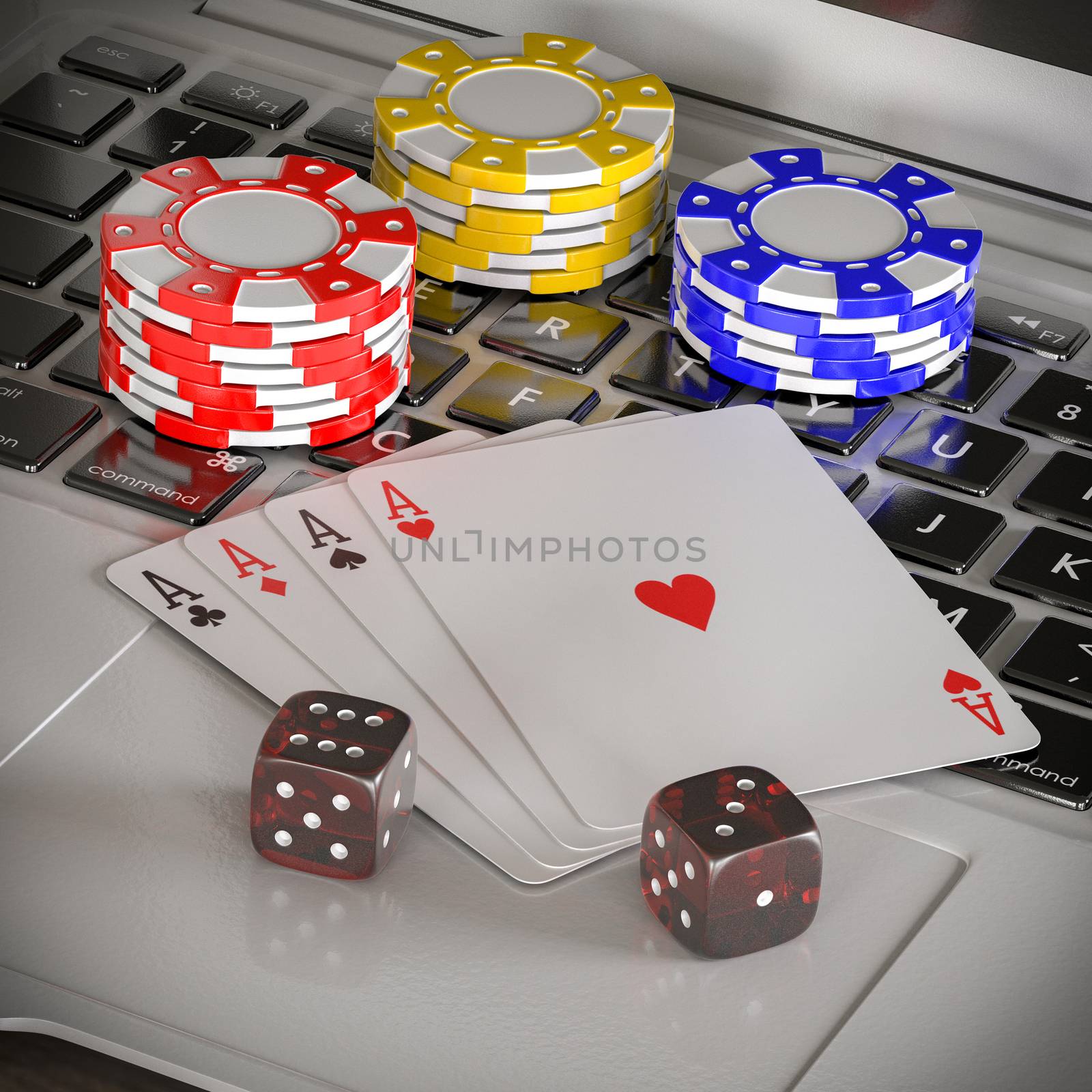 laptop with chips, dices and poker cards on the table