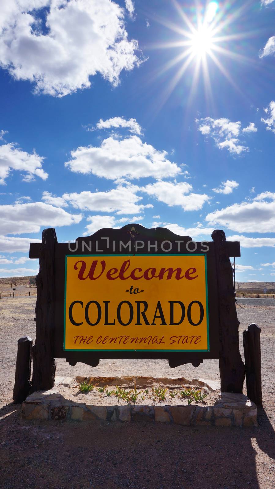 Welcome to Colorado road sign with blue sky