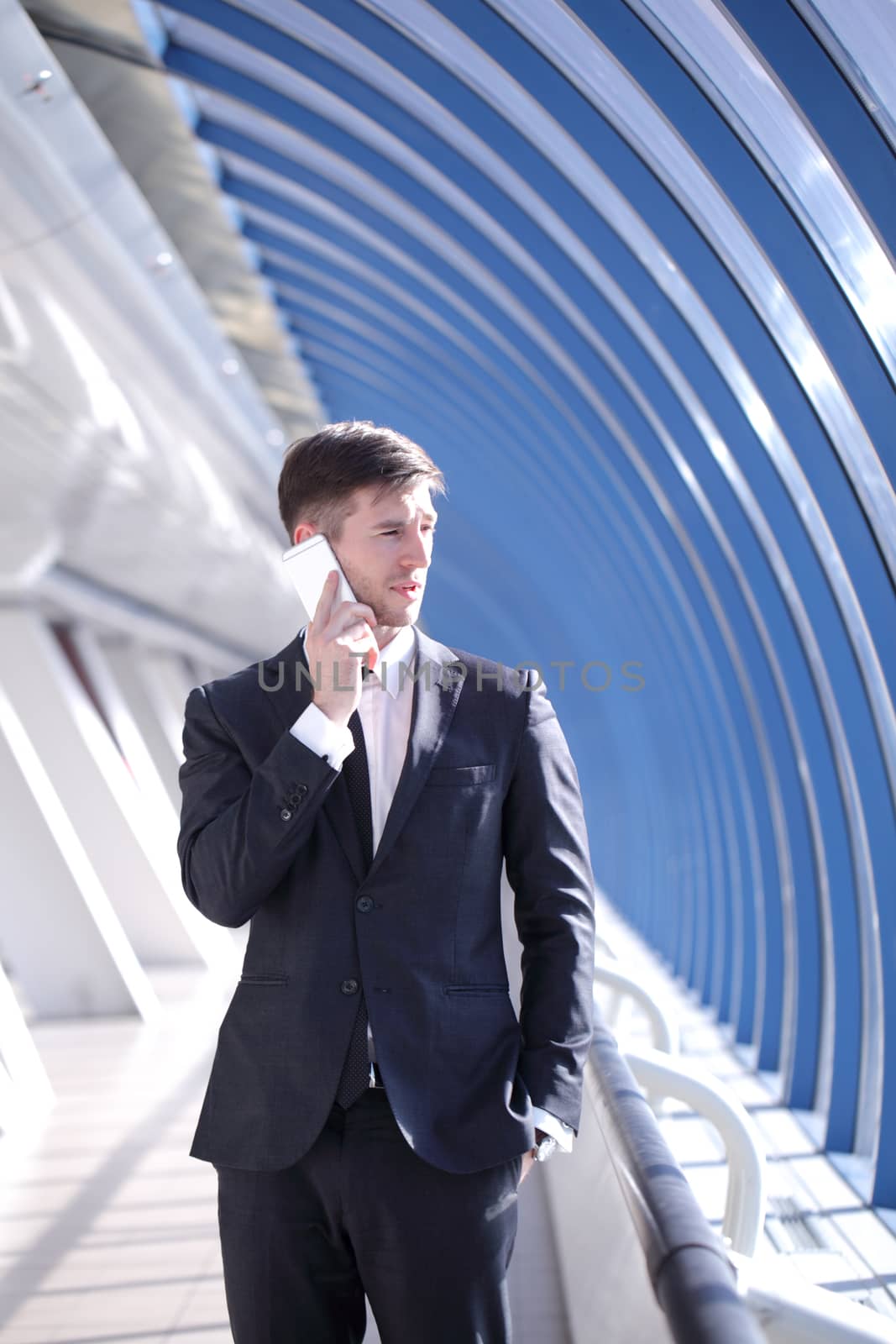 Businessman talking on the phone in modern building