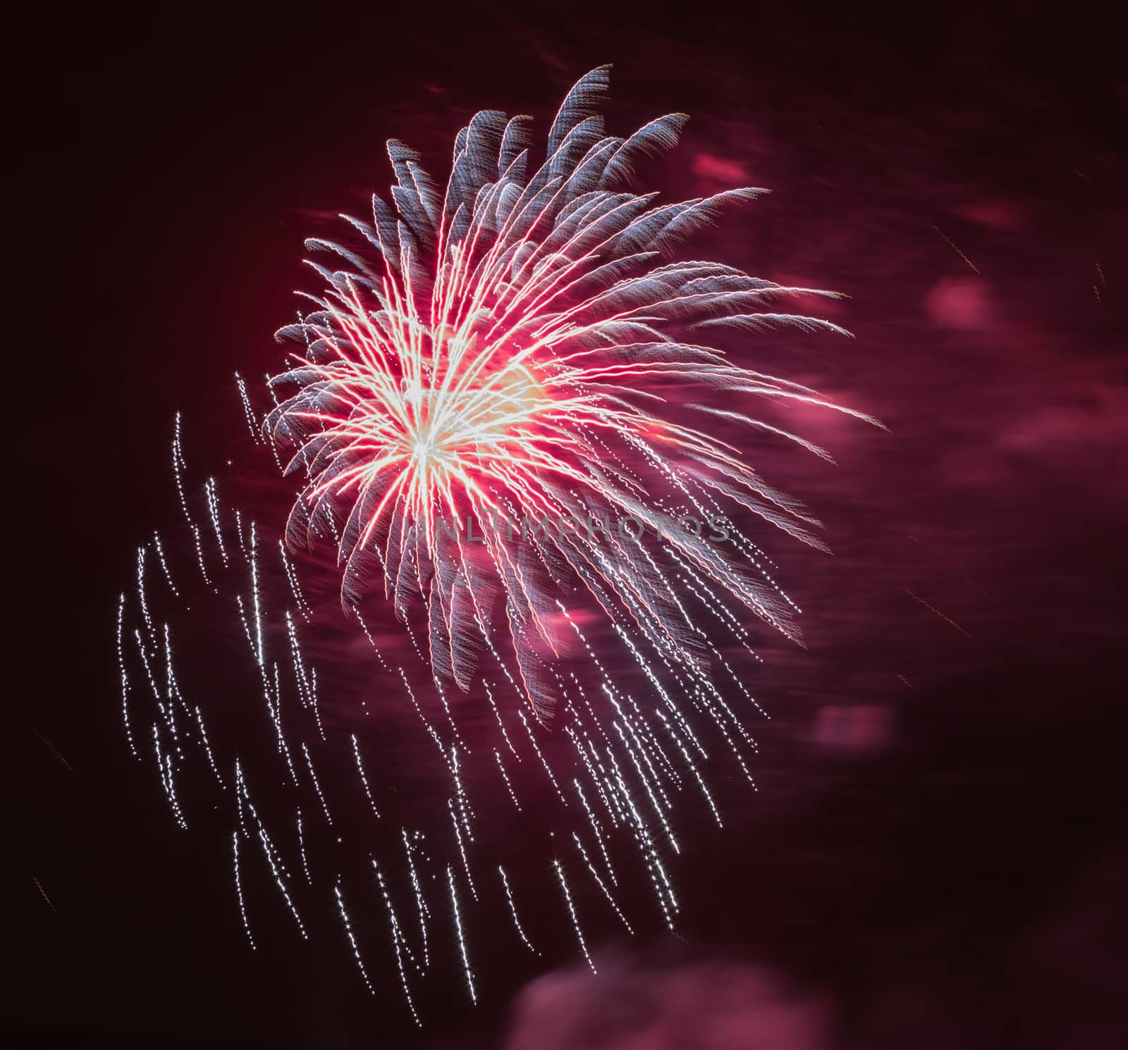 Brightly colorful fireworks and salute of various colors in the night sky background