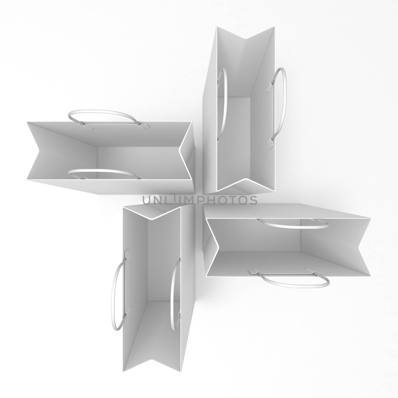 Empty shopping paper bags, arranged and isolated on white. Top view