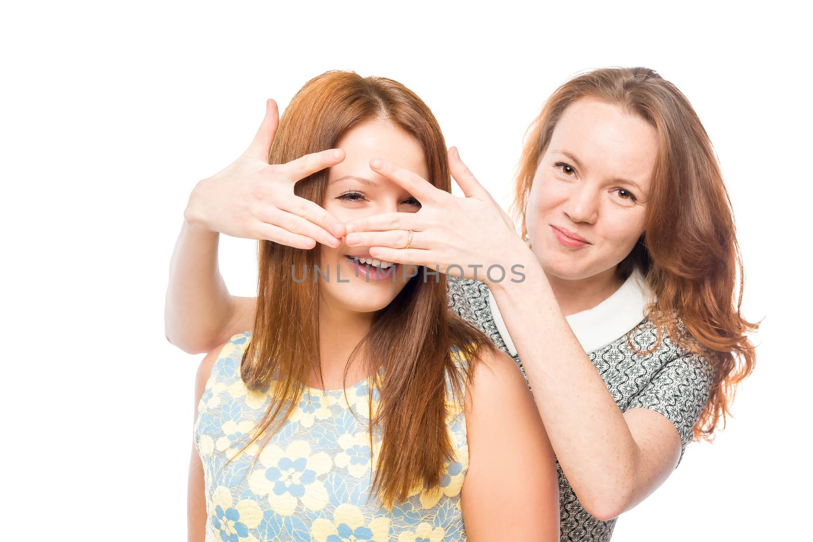 happy girlfriends posing on a white background isolated