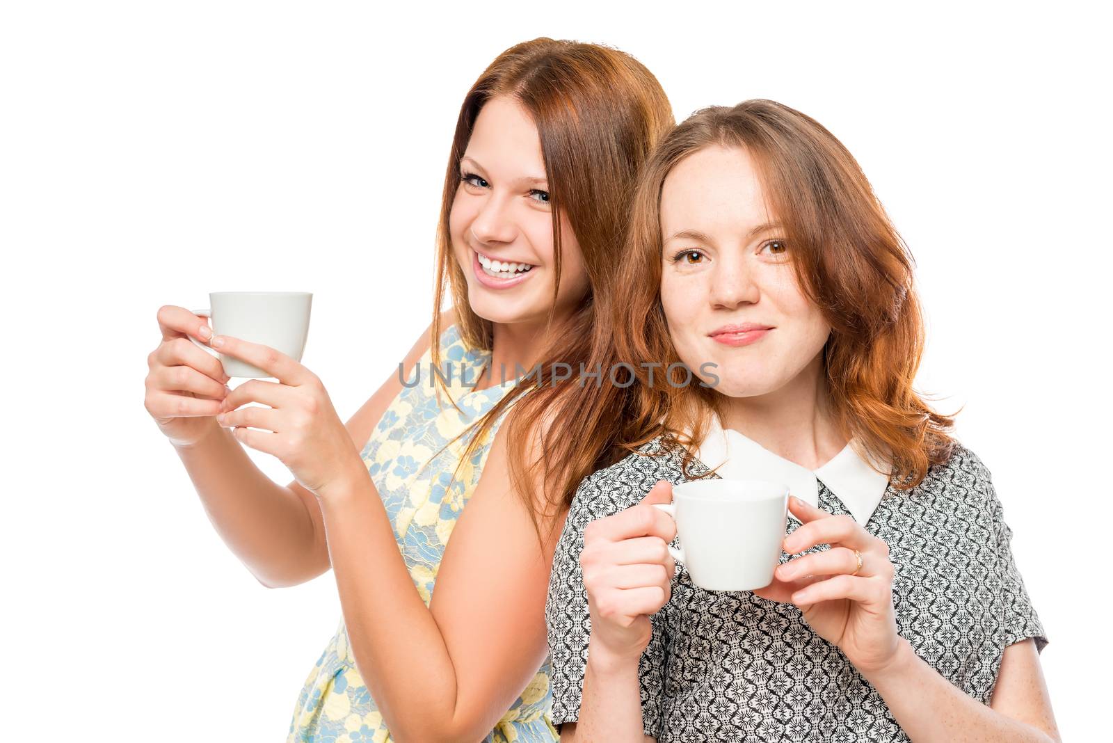 portrait of a beautiful female friends with tea on a white background