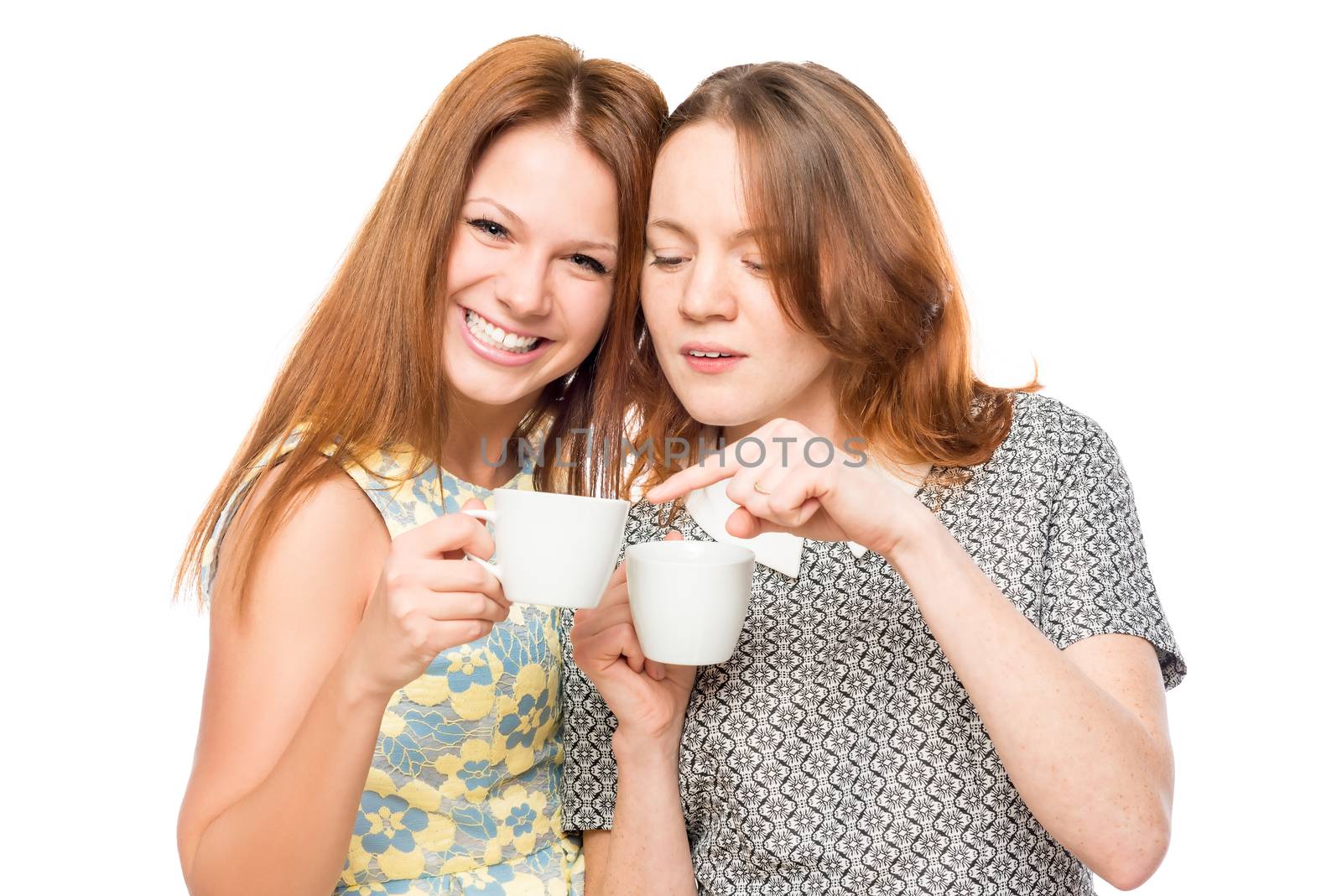 funny girlfriends gossiping and drinking tea on a white background