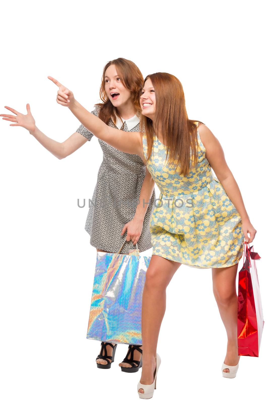 girl shows her friend where discounts on a white background