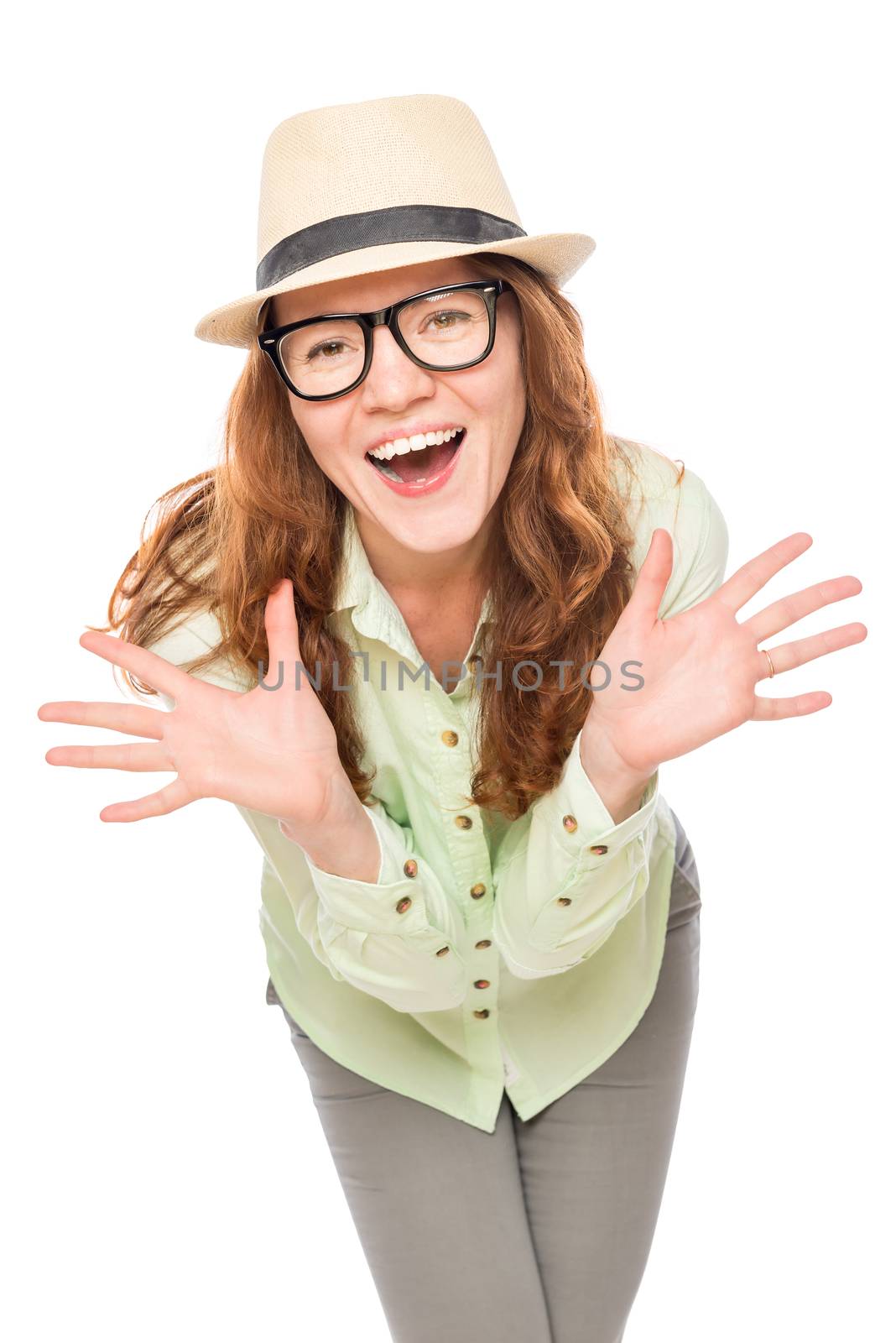 emotional girl in glasses and a hat on a white background