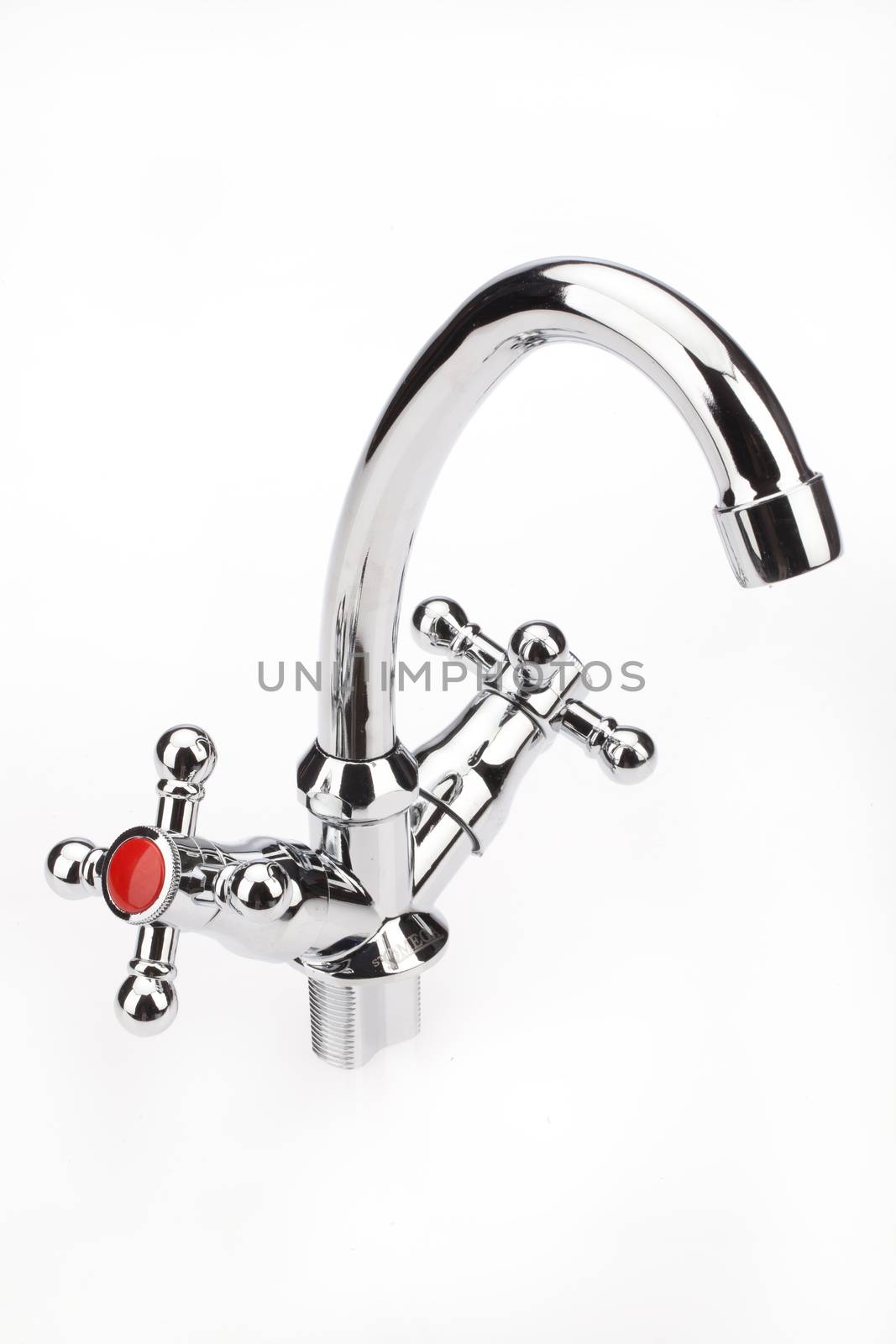 Metal chromium-plated water mixer on an isolated background