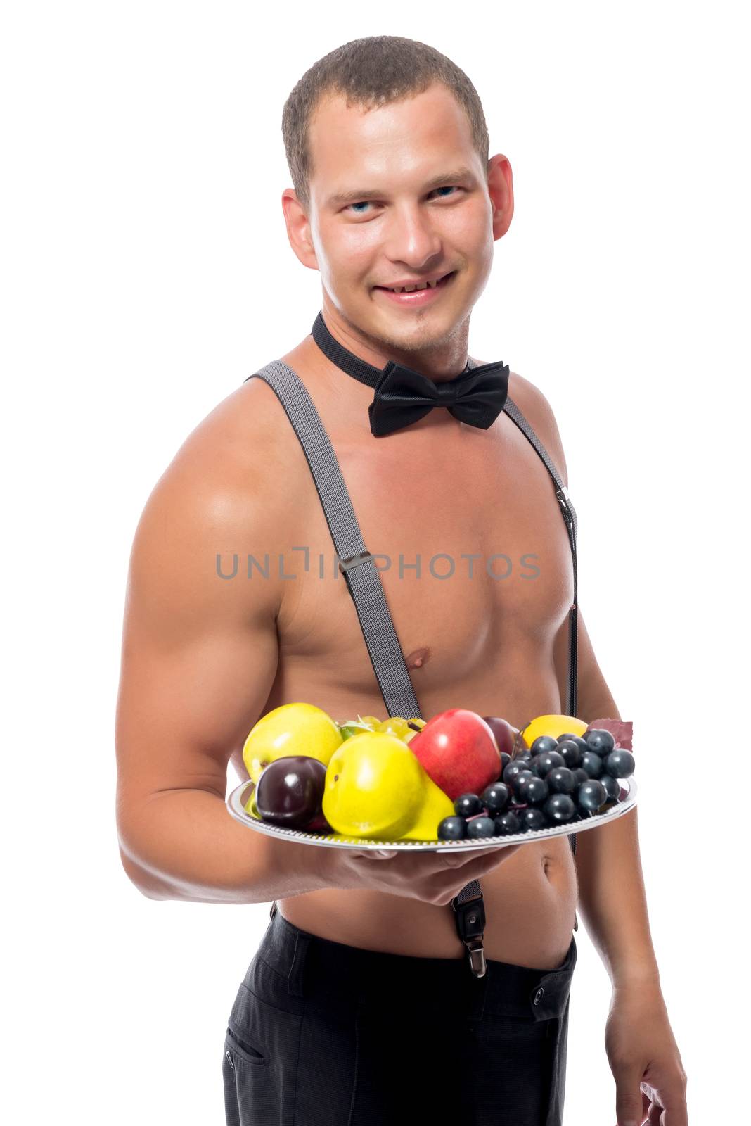 handsome waiter with a tray of fruit on a white background isolated