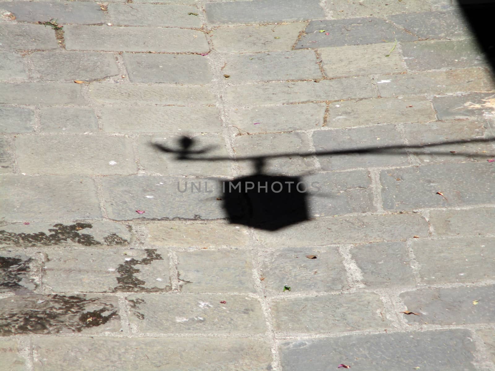 shadow of a lantern on the old cobblestones