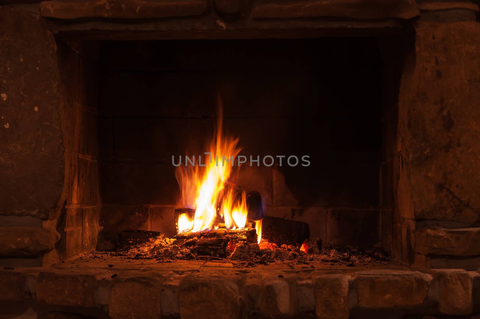 Burning pieces of wood in a fireplace