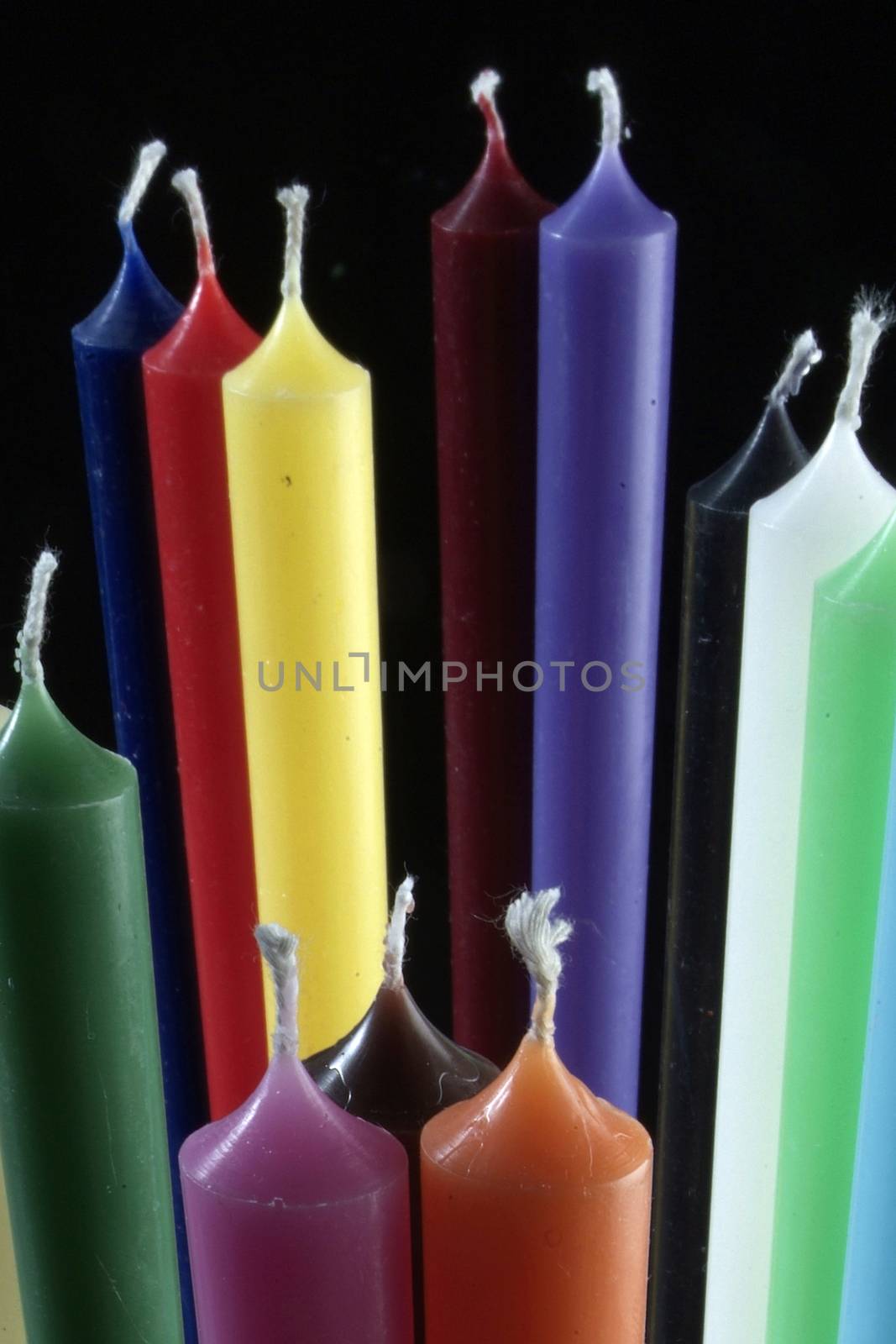 group of colorful cylindrical candles h by diecidodici