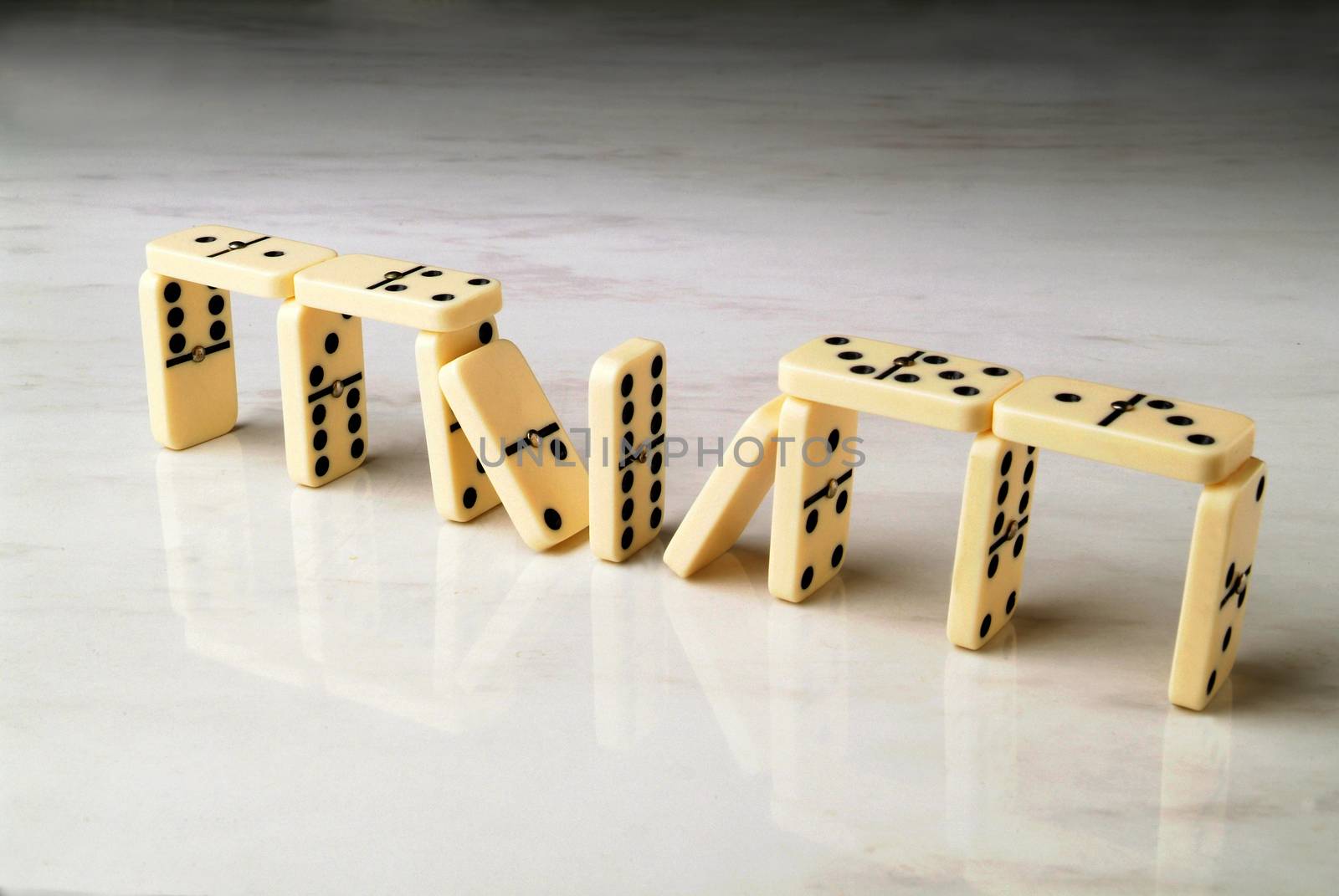 construction made with dominoes on a neutral background