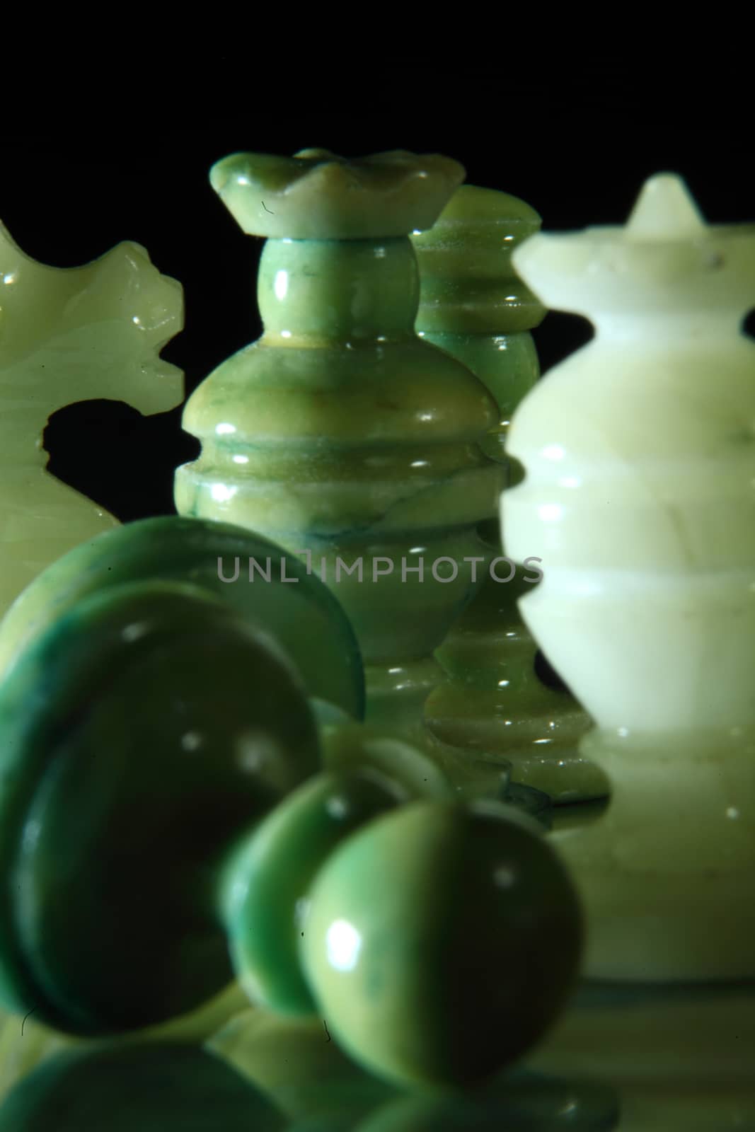 chessboard and alabaster chess on a black background