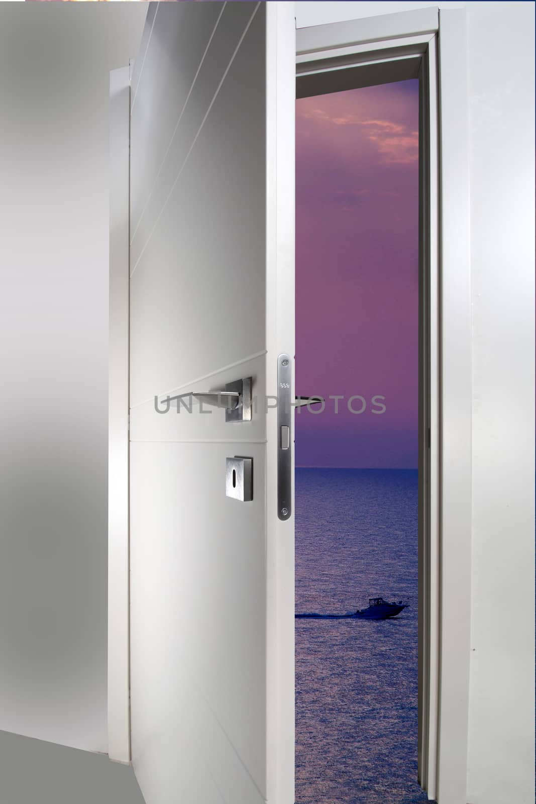 white door open to the sea 